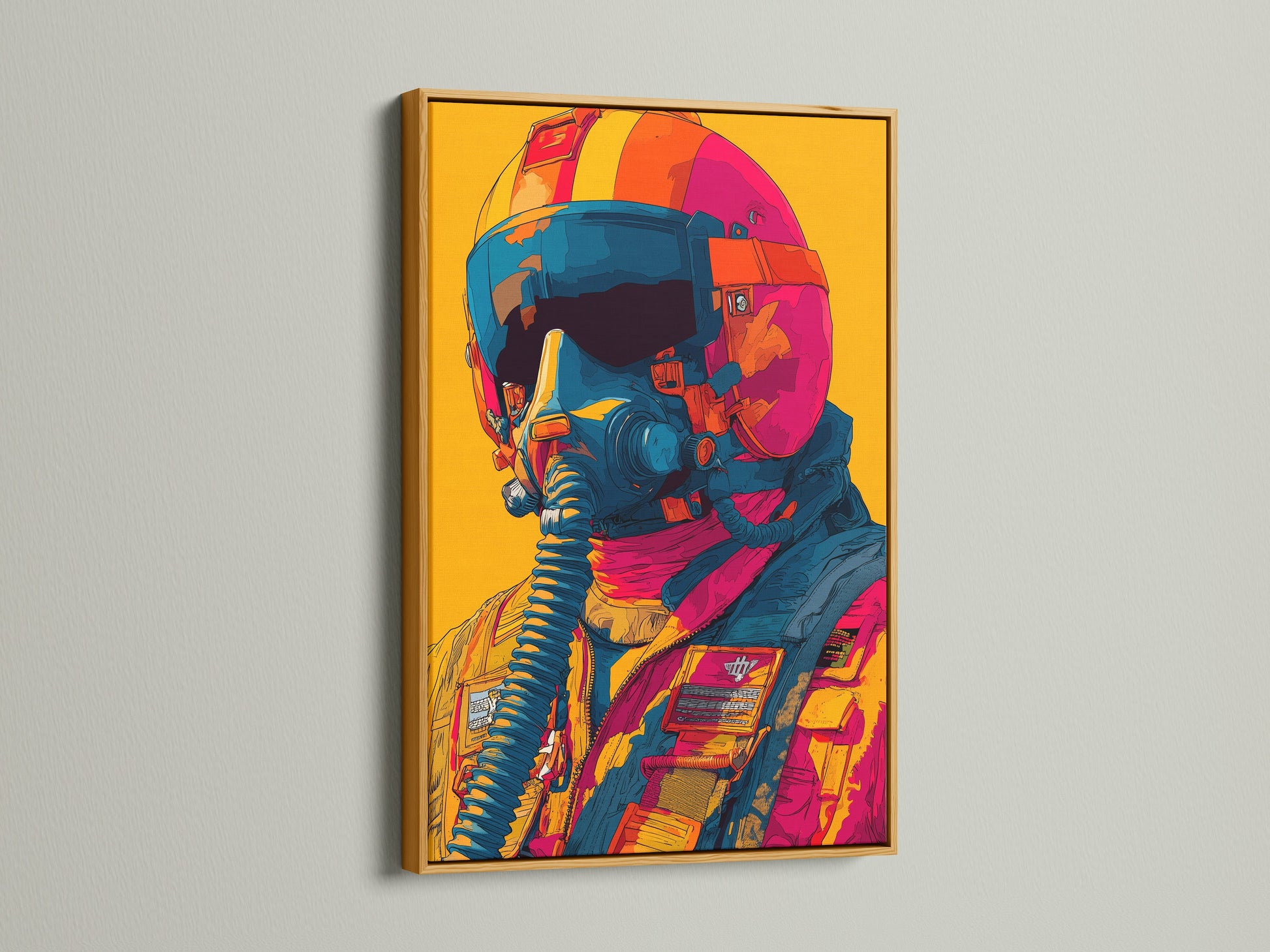 Artwork in a gold frame is showcased on a white wall. The art features a pilot with a helmet and mask. The gold frame brings a touch of elegance. This piece is a luxurious addition to your space.
