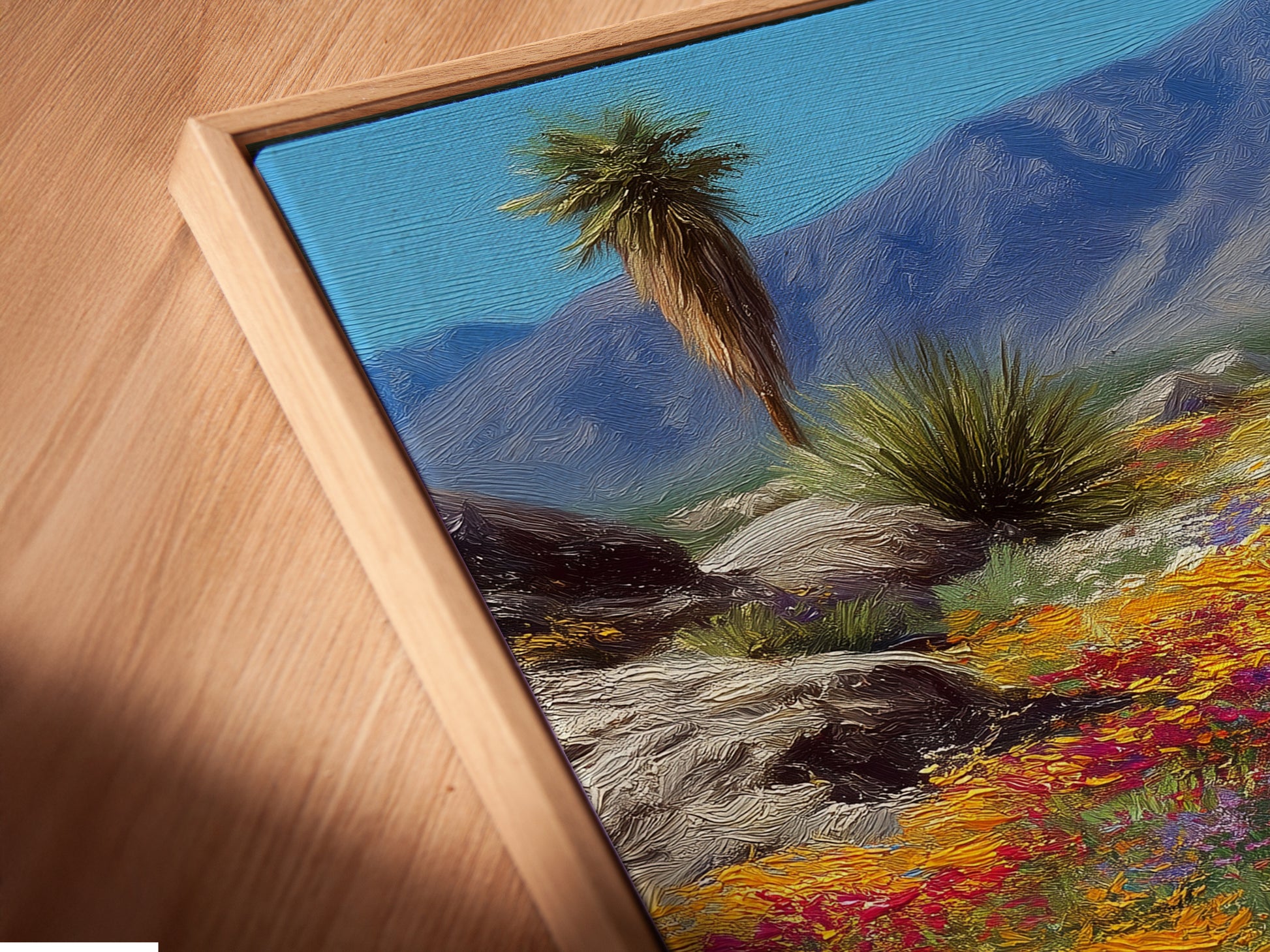 A close-up shows a canvas print in a floating frame. This desert wildflower artwork is beautifully displayed. The floating frame adds depth to the colorful landscape print. It's ideal for showcasing Southwest nature wall decor. This artwork elevates your space.