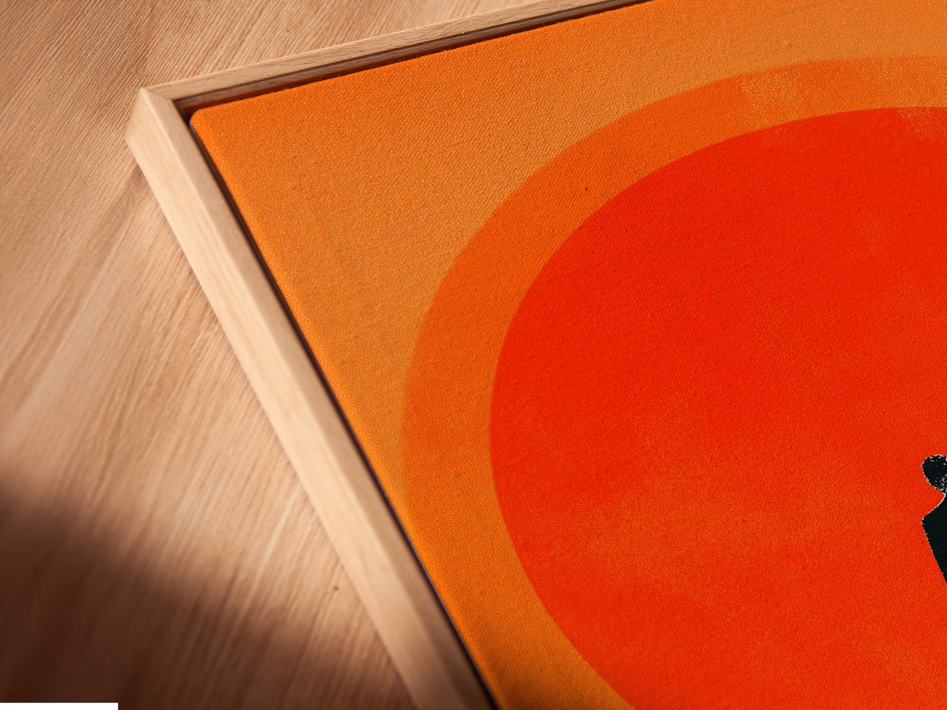 Angled close up of a canvas print in floating frame. The frame adds depth and dimension. The artwork appears to float within the frame. This creates a modern gallery look. It is perfect for showcasing art. The artwork features chess pieces and a figure walking towards a red sun.