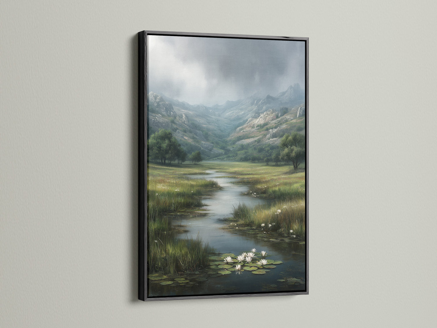 A striking black frame surrounds a landscape artwork. The art print showcases a river flowing through a lush valley. The dark frame adds contrast to the artwork and the light wall. This creates a bold and sophisticated look. The artwork becomes a focal point in the room.