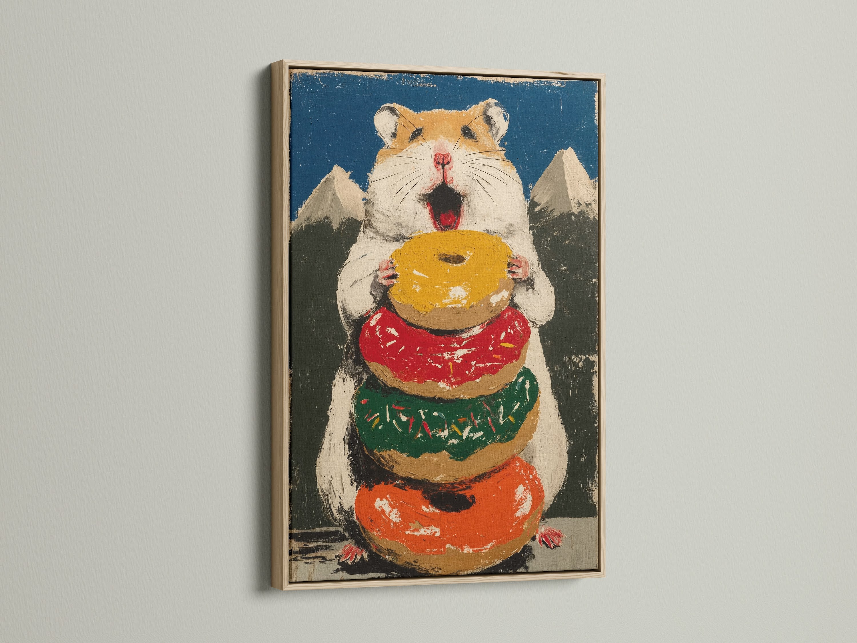 Hamster Donut artwork with an oak frame. The art is perfect for a kitchen or bakery. The artwork features a cute hamster holding a stack of colorful donuts. The primary color is orange. The secondary color is blue. This is a fun piece.