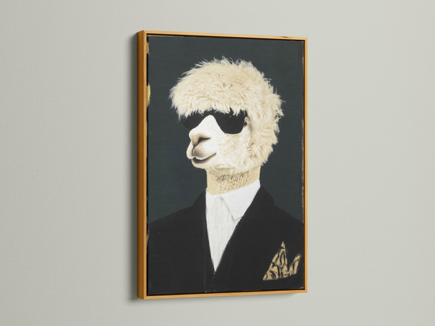 Cool Llama Art Print in a gold frame hangs on a white wall. This quirky animal wall art features a llama wearing sunglasses and a suit. The gold frame adds a touch of elegance. Perfect formal portrait canvas print for office wall decor.