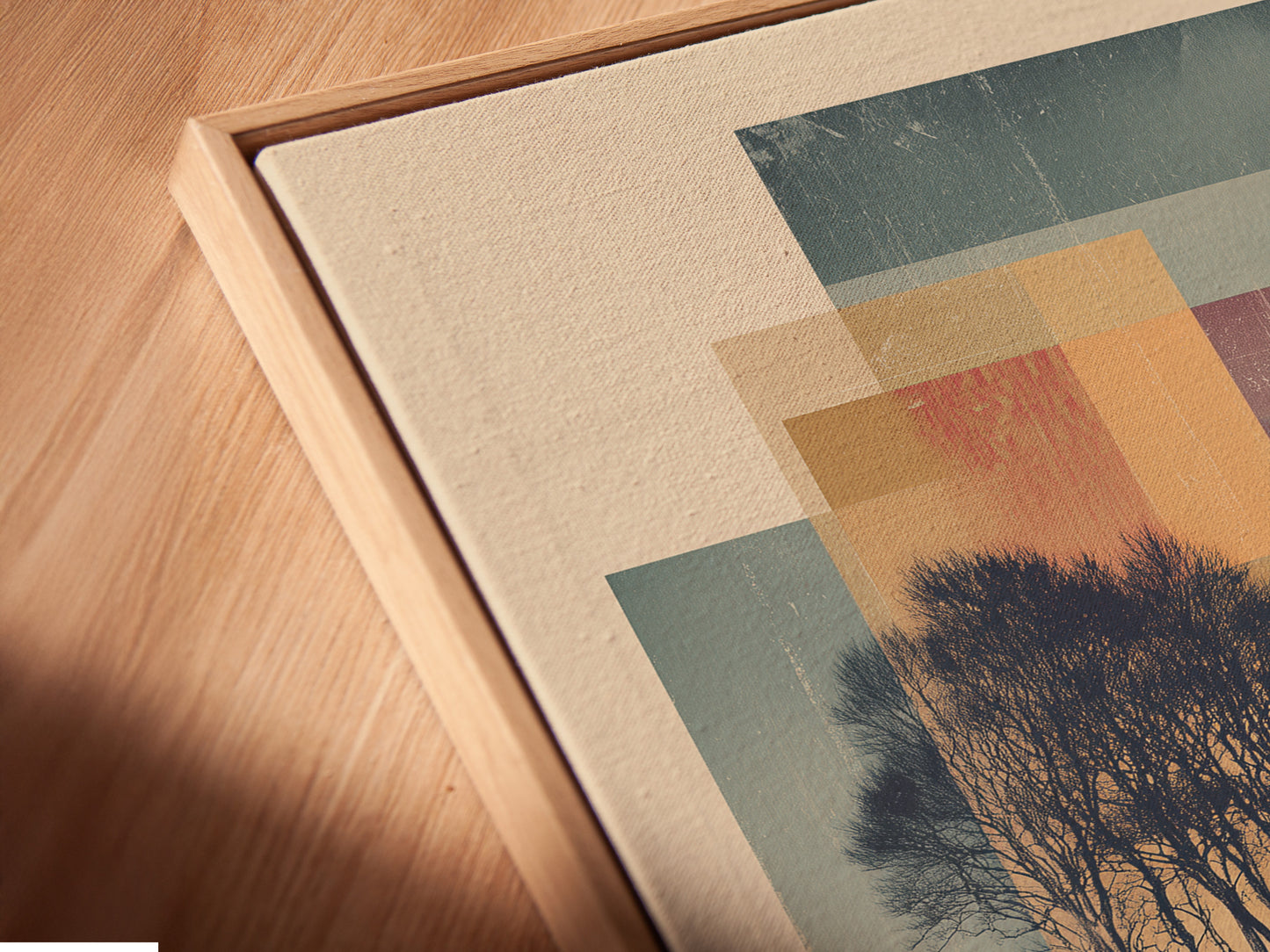 Angled close up of a canvas print in a floating frame. The artwork is a beautiful landscape. It would be a great addition to your home. The floating frame gives the artwork a modern look.