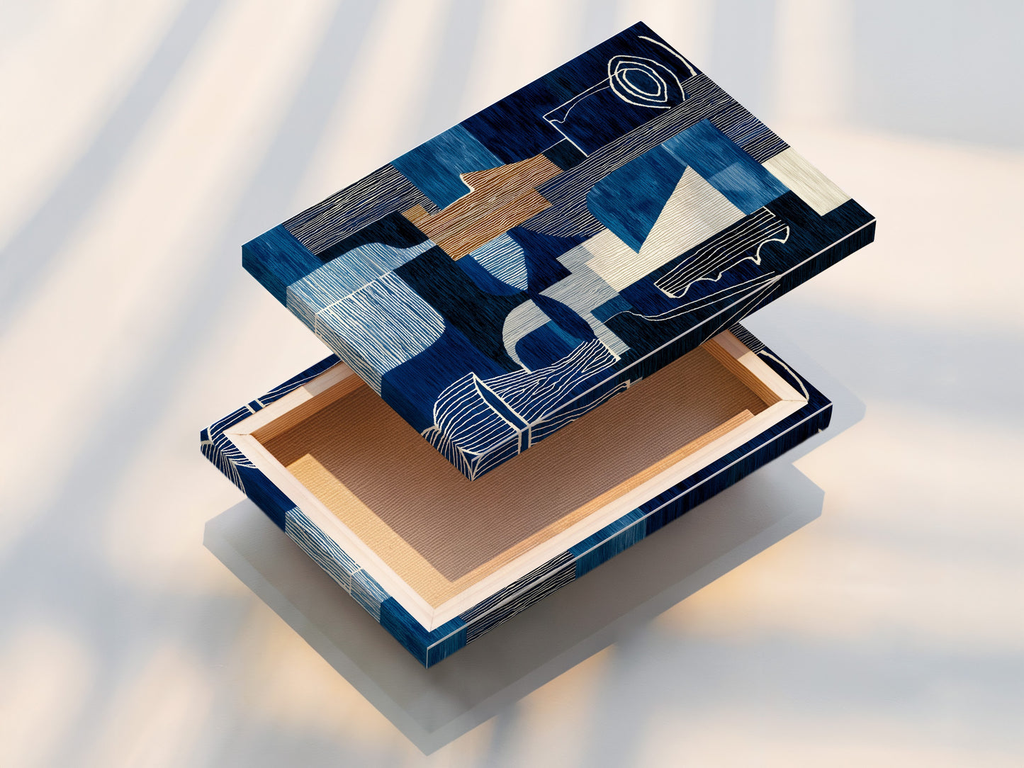 A stretched canvas print displays our captivating abstract blue artwork. The modern geometric navy and white art is perfect for any room. Add a touch of sophistication to your home or office. Explore our high-quality stretched canvas prints today!