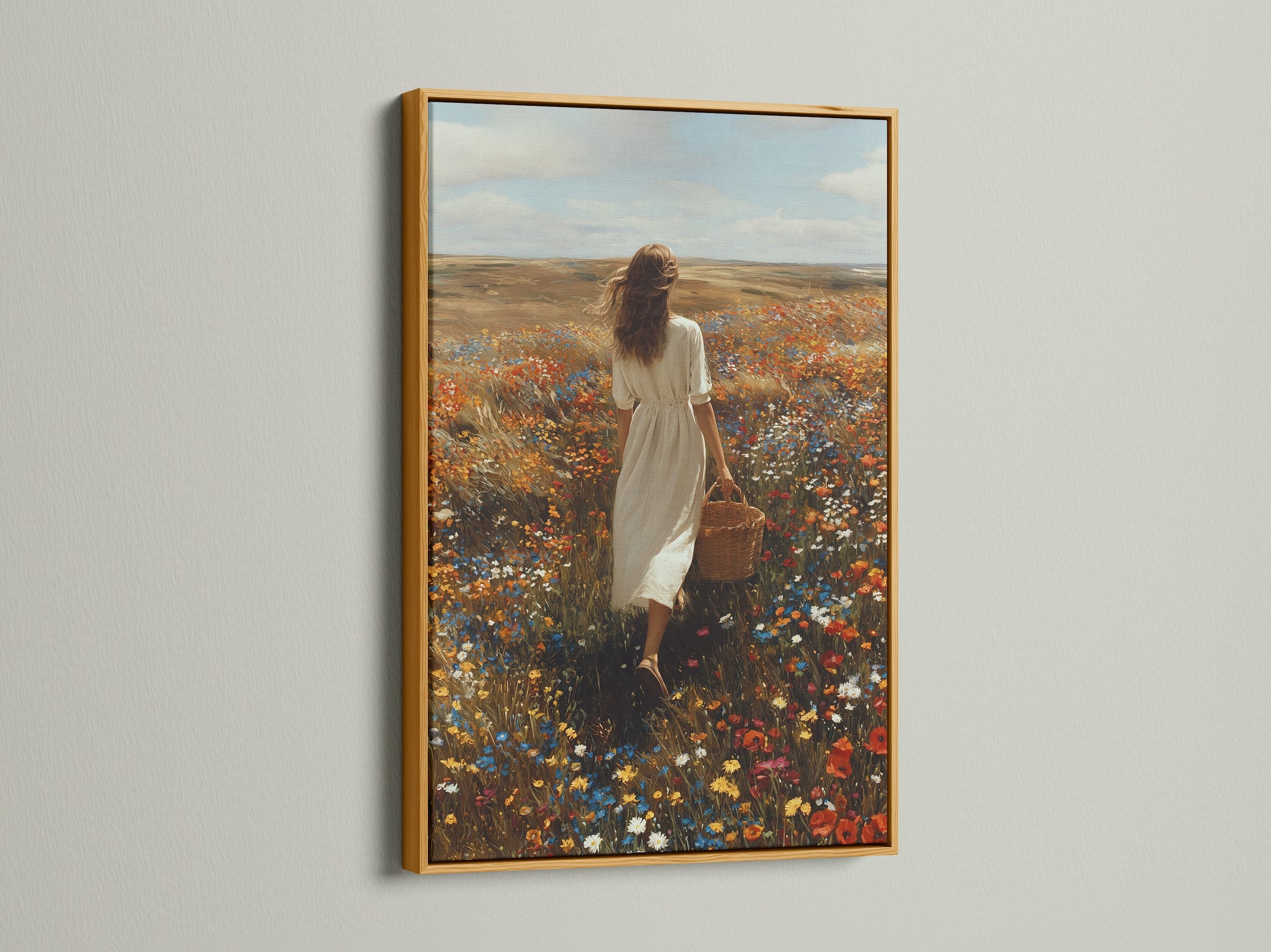Gold frame artwork displayed in a well-lit room. The art captures a woman walking through a field of flowers. The golden frame adds a touch of luxury. It enhances the artwork's elegance. Find the perfect frame to showcase your art. Elevate your space with stunning framed artwork.