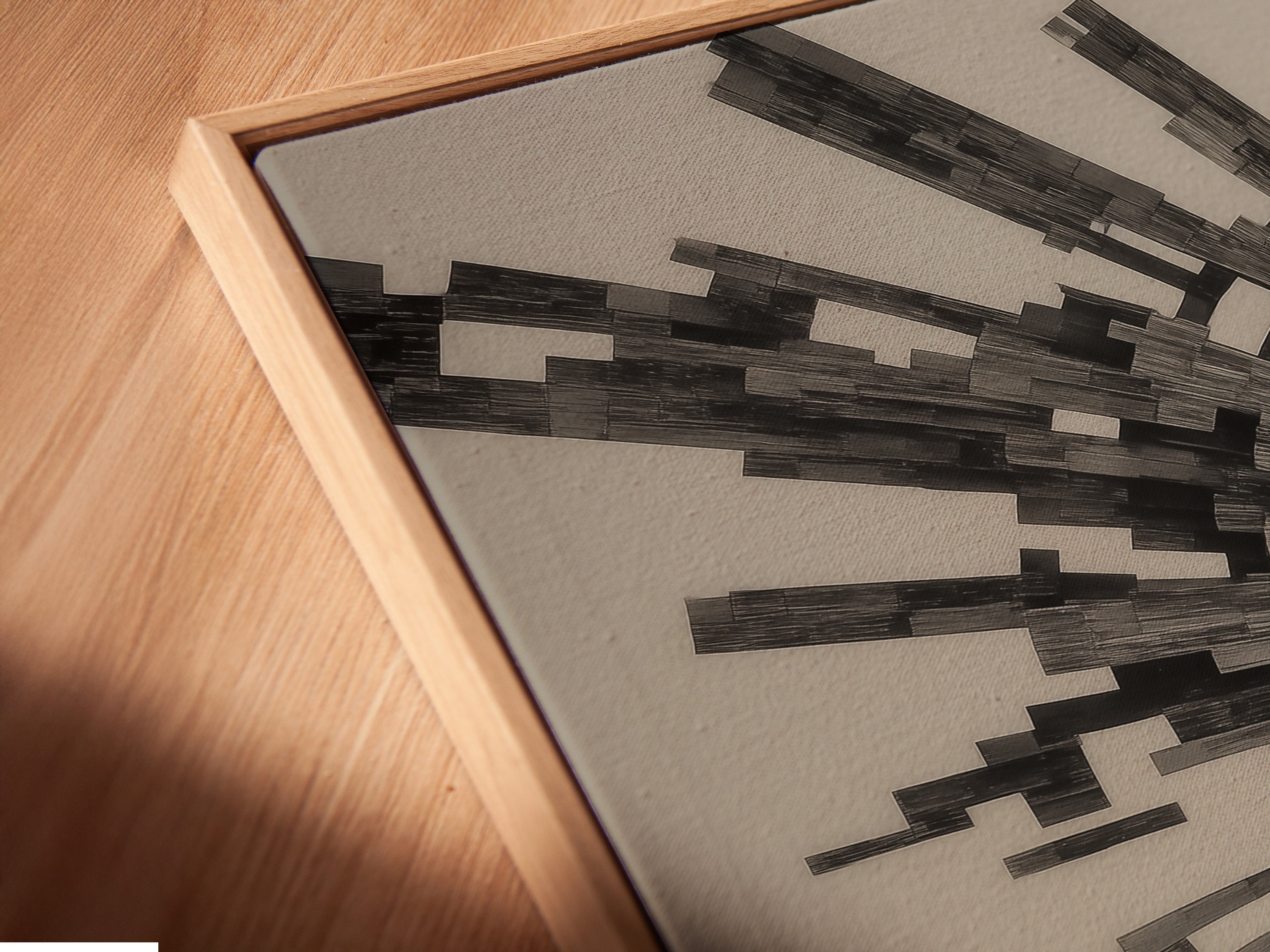 Angled close-up of a canvas print in a floating frame. The Surreal Architecture artwork features abstract geometric elements. The monochrome poster is perfect for modern office decor. It enhances minimalist Scandinavian or eclectic spaces.