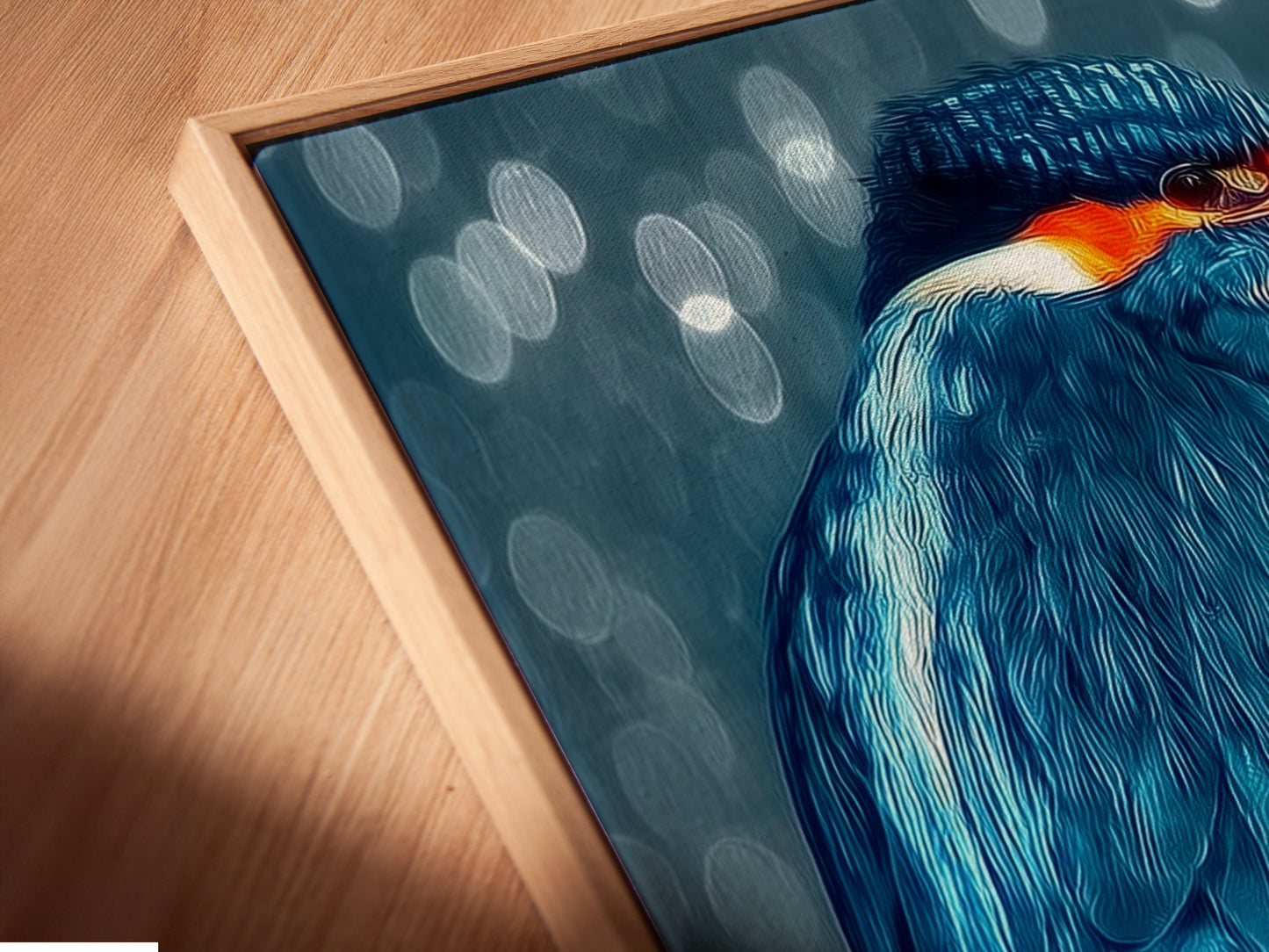 A close-up shows a canvas print in a floating frame. The kingfisher artwork appears modern. The fine art detail is visible in this wildlife print. Perfect for elevated modern wall art settings