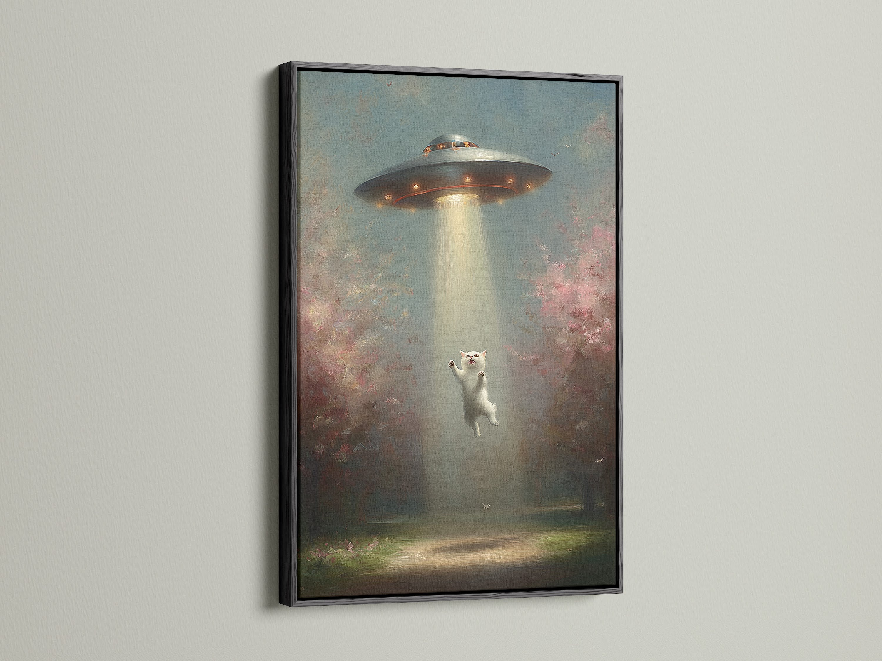 The UFO Cat art print is showcased in a black frame. This striking contrast emphasizes the surreal canvas art. The black frame adds a bold touch to your wall decor.