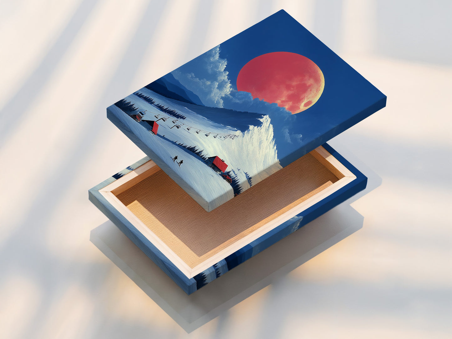 This is a stretched canvas print of ski resort artwork. The winter scene features an alpine mountain landscape. The coral moon adds a touch of magic. It's ready to hang and enjoy in any room. This canvas print brings the beauty of winter indoors.