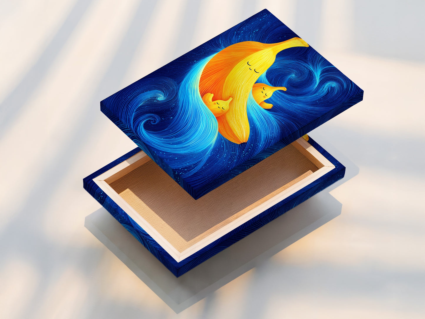 A stretched canvas print of the Banana Family Canvas artwork is displayed. The yellow and blue art adds a modern touch to any room. This whimsical art is perfect for kids room decor. It is a fun abstract fruit wall art.