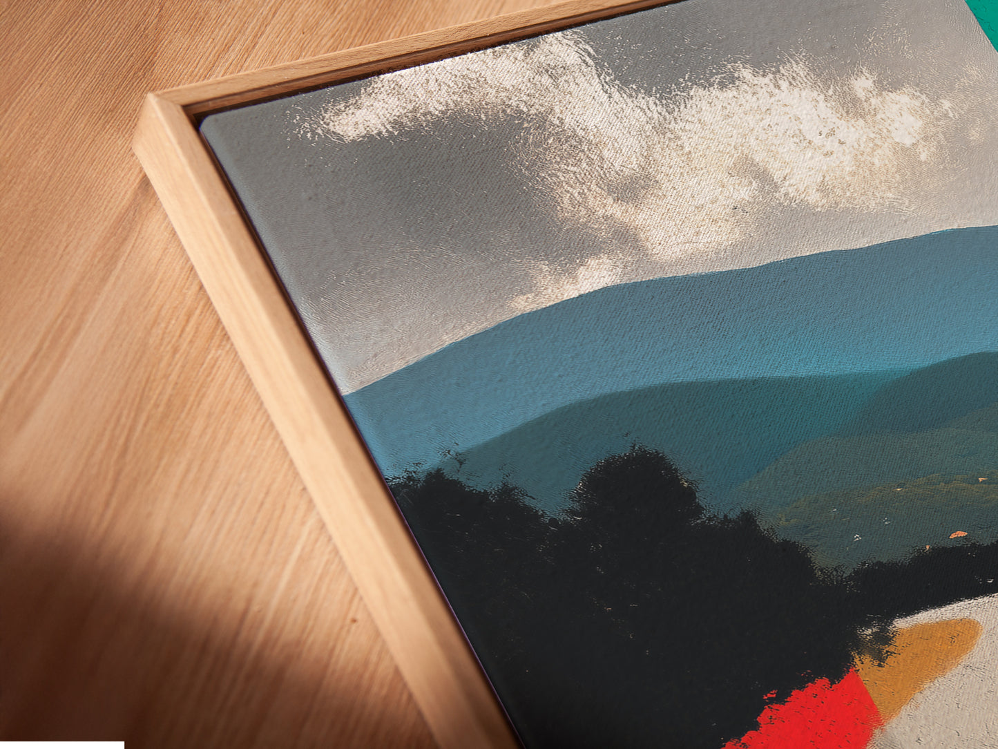 A close-up angled view of a canvas print in a floating frame. The artwork shows a vintage sports car on a colorful road. The floating frame gives the artwork a modern gallery look. Ideal for showcasing your love for classic cars.  Perfect for any space.