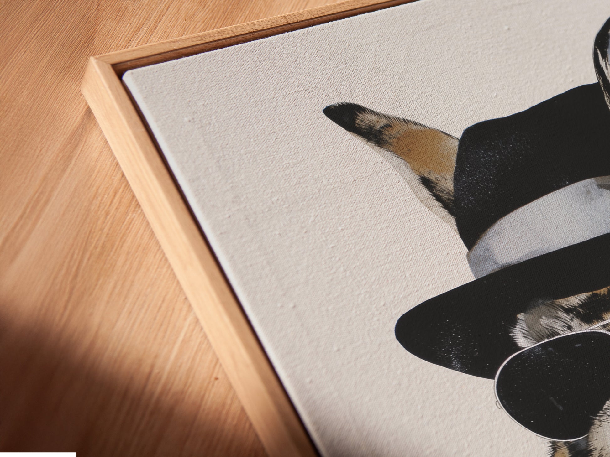 A close-up of the Gentleman Rabbit canvas print in a floating frame. The floating frame gives a modern gallery look. This dapper bunny wall artwork enhances any room. Perfect for adding a contemporary touch. The artwork looks stunning and sophisticated.