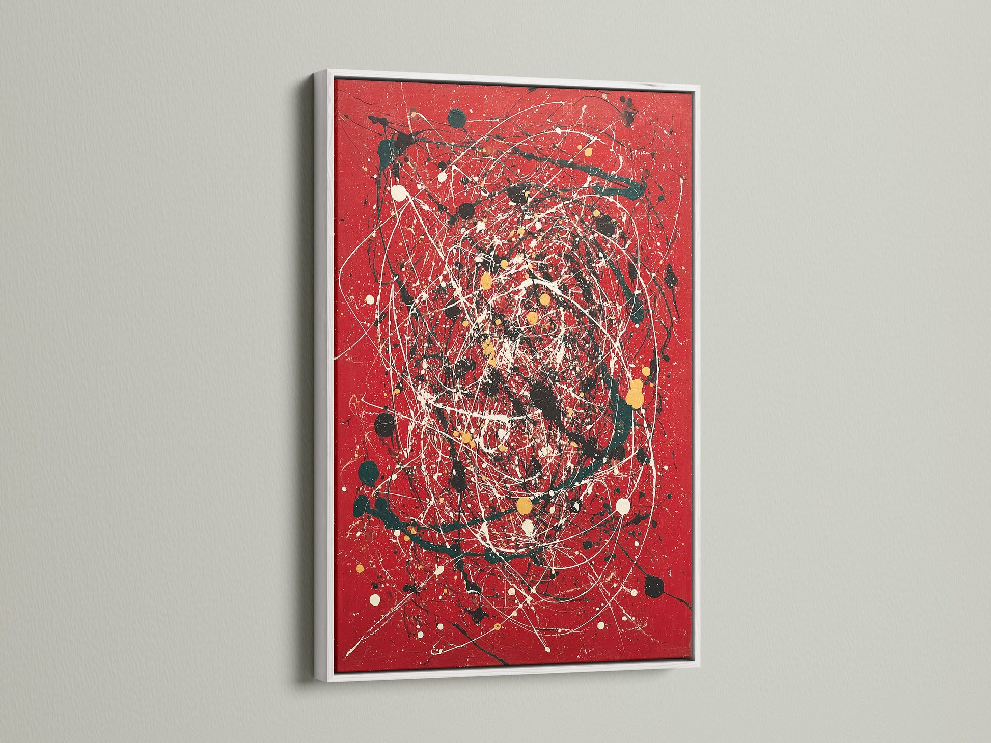 Modern abstract wall art with a red canvas print. The artwork is presented in a clean white frame. Splatter and paint drip effects create a contemporary feel. This piece is ideal for modern home decor. It enhances living rooms offices and creative spaces. A bold addition to any art collection.