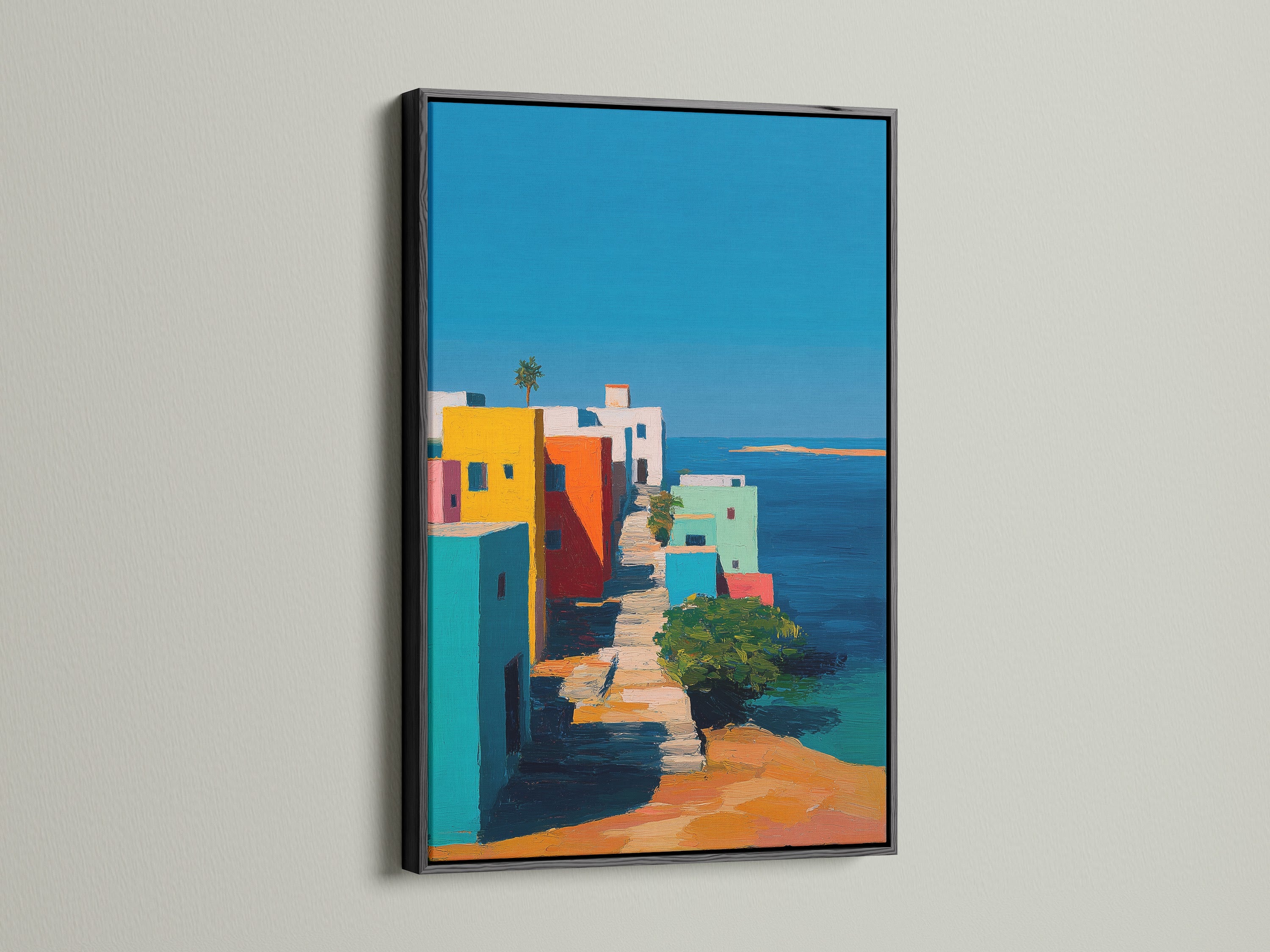A sleek black frame highlights a captivating art print. The dark frame adds a touch of elegance. The artwork presents a colorful coastal town. It creates a striking contrast against the wall. This art piece draws the viewer in.