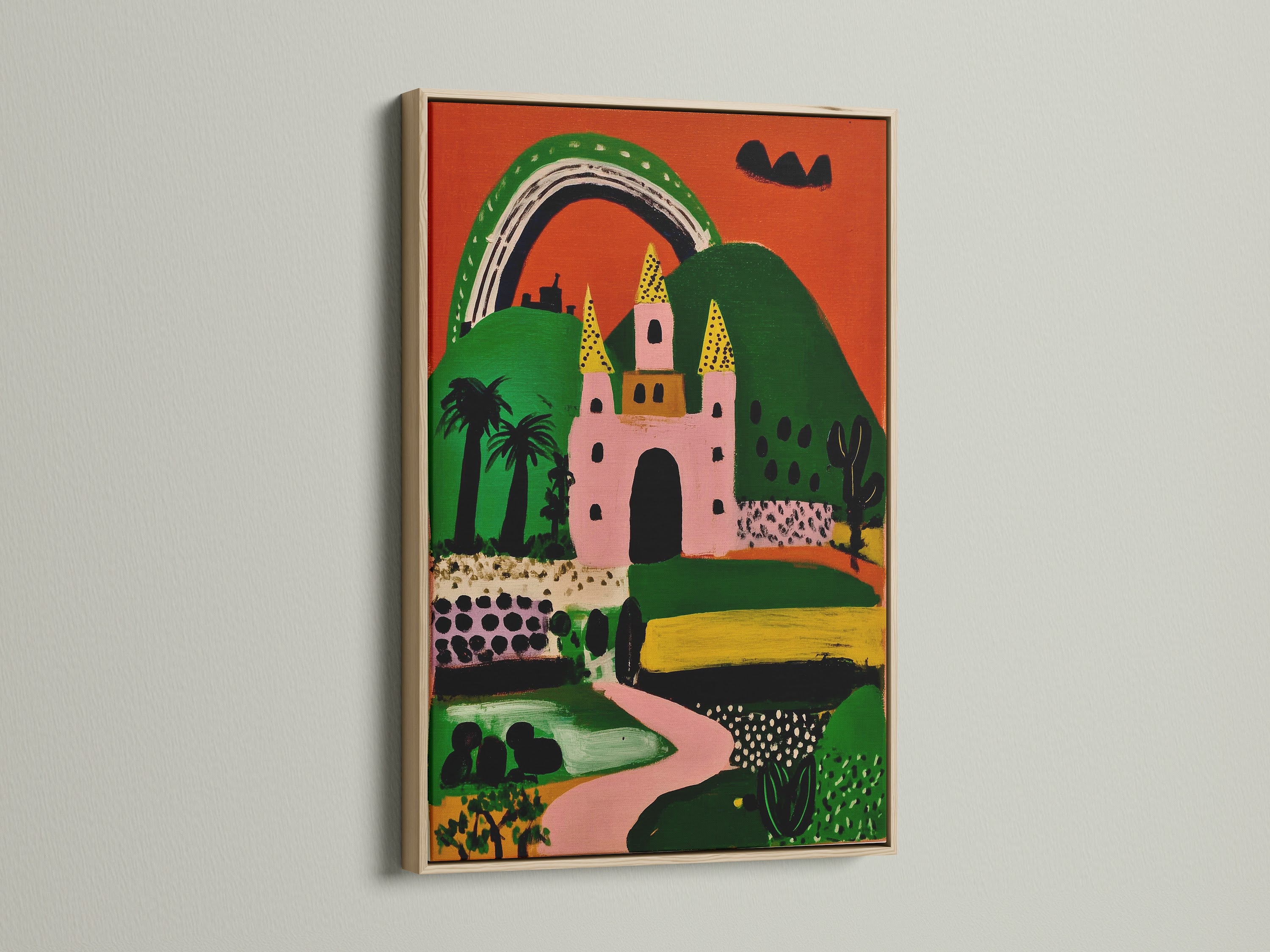 A pink and green fairytale castle art print in an oak frame. This whimsical artwork is perfect for a playroom. It's also great for kids rooms and nurseries. The fairytale print adds a touch of magic.