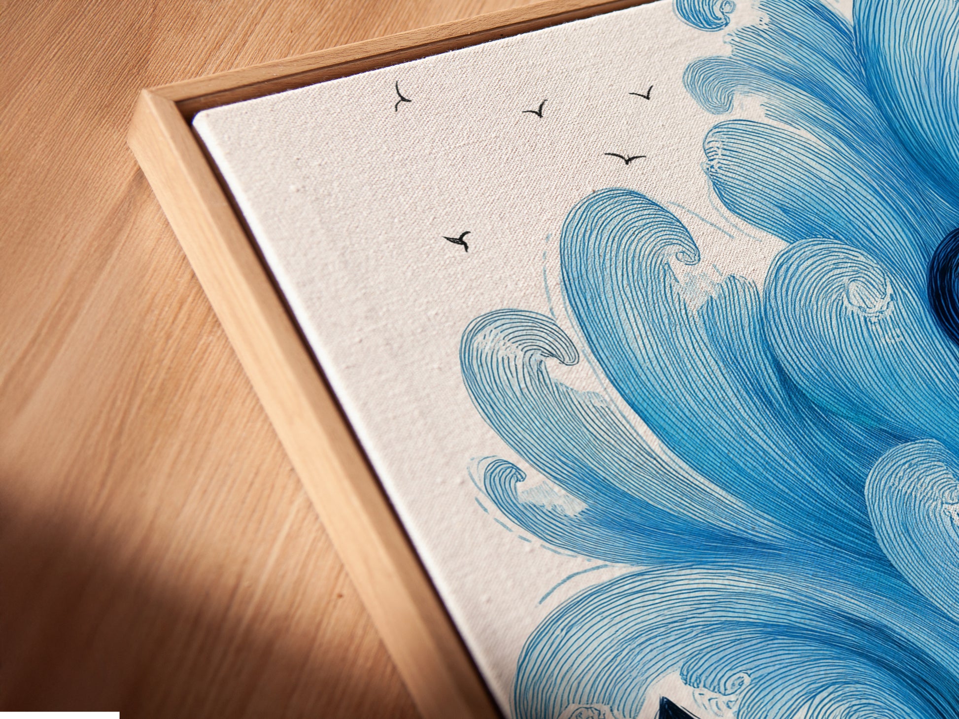 A close-up angled view of our canvas print in a floating frame. The navy blue anchor artwork is prominently displayed. It highlights the artistic details and quality. This coastal artwork is perfect for any room. The floating frame enhances the modern aesthetic. It's ideal for nautical and sea themed spaces.