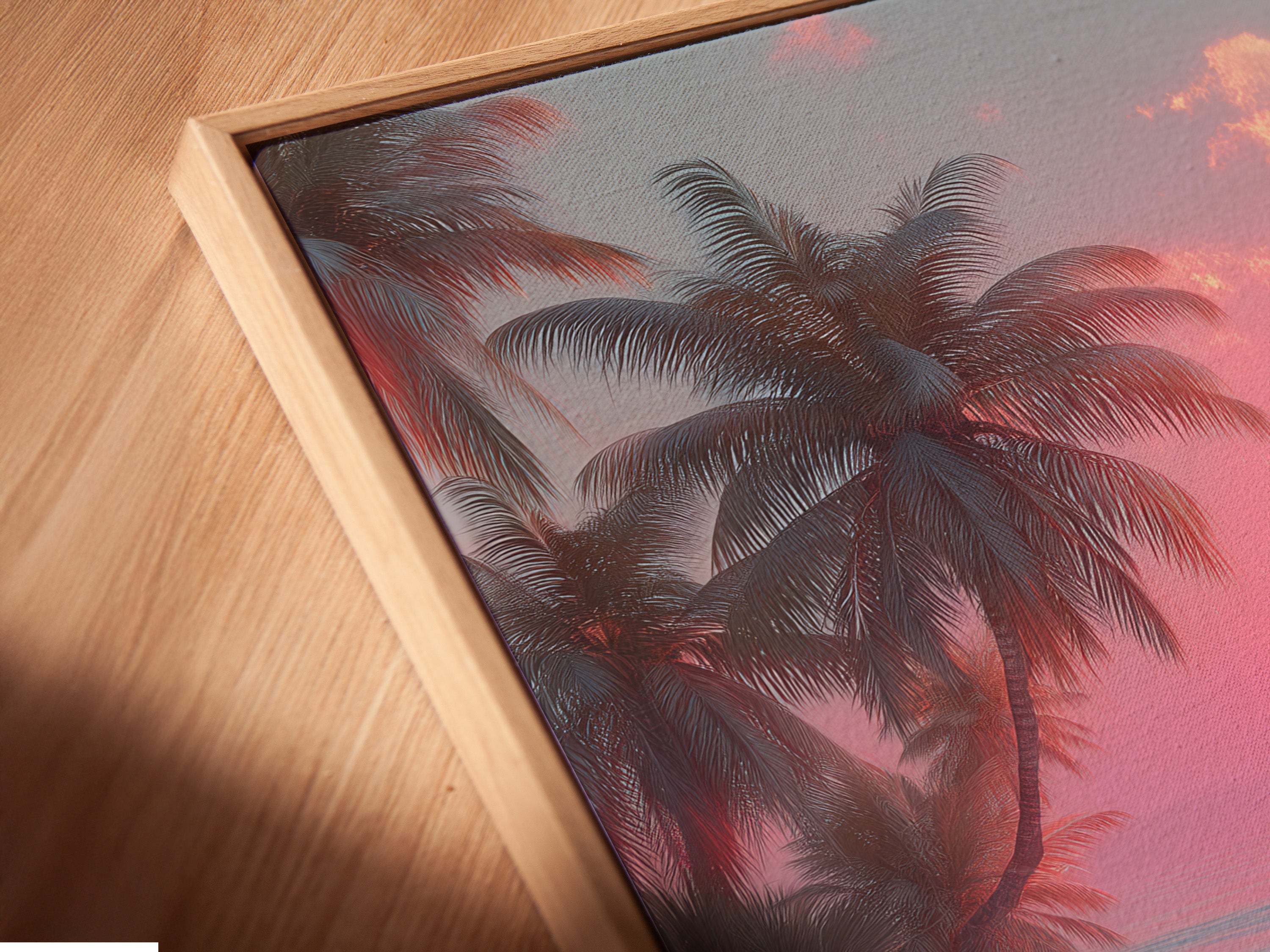 Close-up angled view of a canvas print in a floating frame. The artwork features a serene beach and sunset scene. The floating frame enhances the artwork's visual appeal. A modern and stylish way to display art.