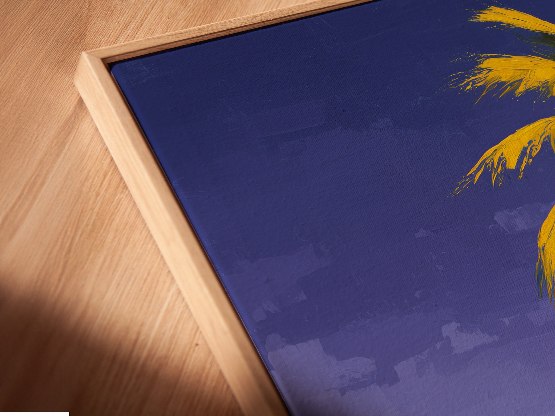 A close-up angled view shows a canvas print in a floating frame. The artwork features a tropical beach scene with palm trees and ocean views. Perfect for coastal and tropical decor styles. Enhance your space with this art.