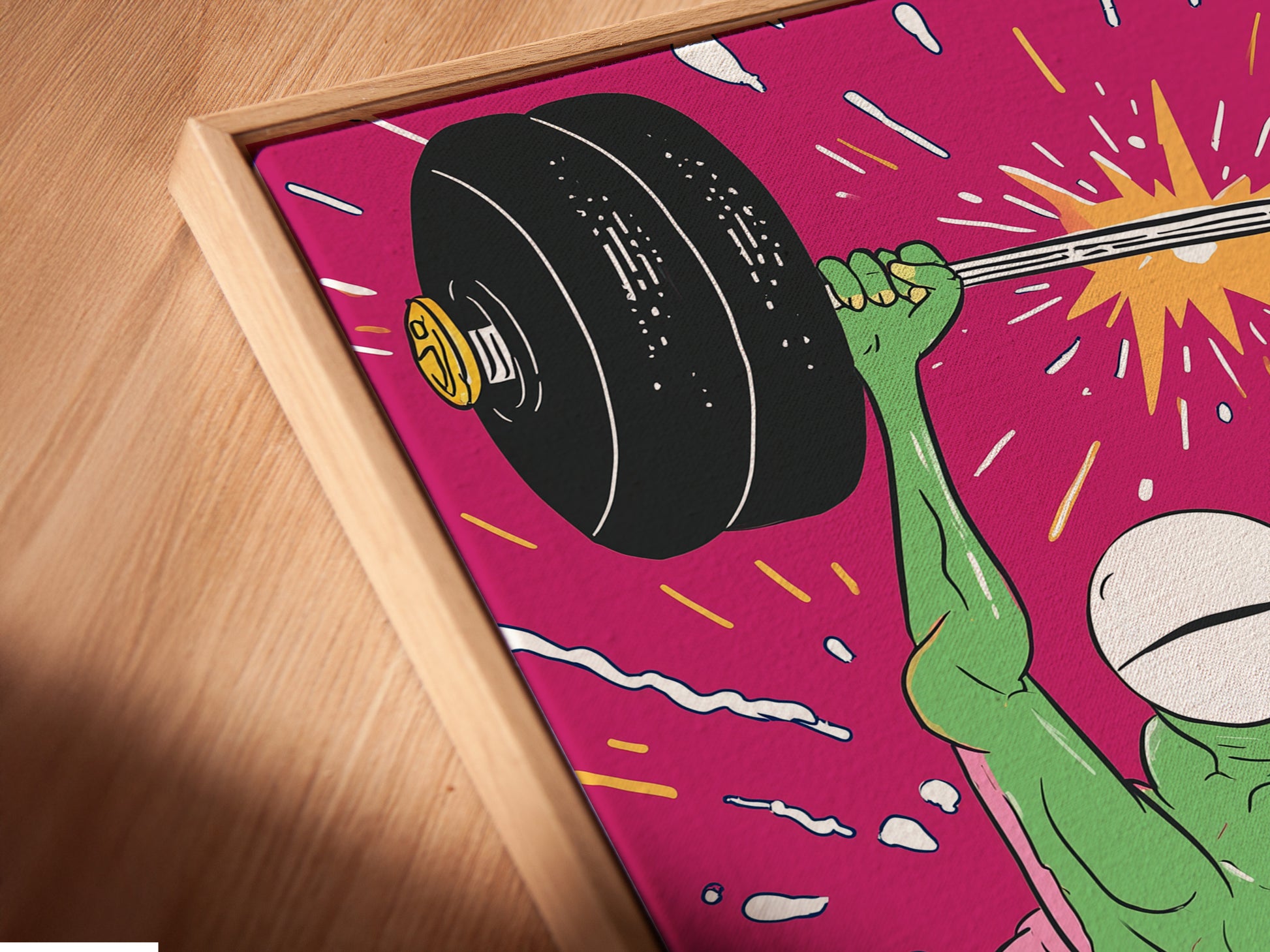 Angled close up of a Fitness Frog canvas print in a floating frame. See the detail of the weightlifting gym art. The quirky motivational poster adds a unique look. Perfect for any home gym wall.