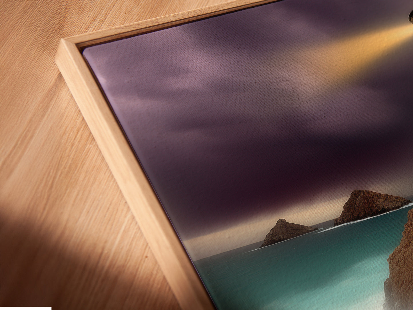 A close up of a canvas print in a floating frame. The floating frame enhances the artwork. Perfect for showcasing coastal art. Discover our range of framed art. This offers a modern and stylish display option.