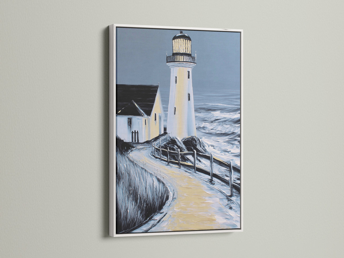 Lighthouse coastal artwork in a white frame. This seascape wall art brightens up your office or home. The white frame enhances the artwork. It is perfect for minimalist and Scandinavian styles.