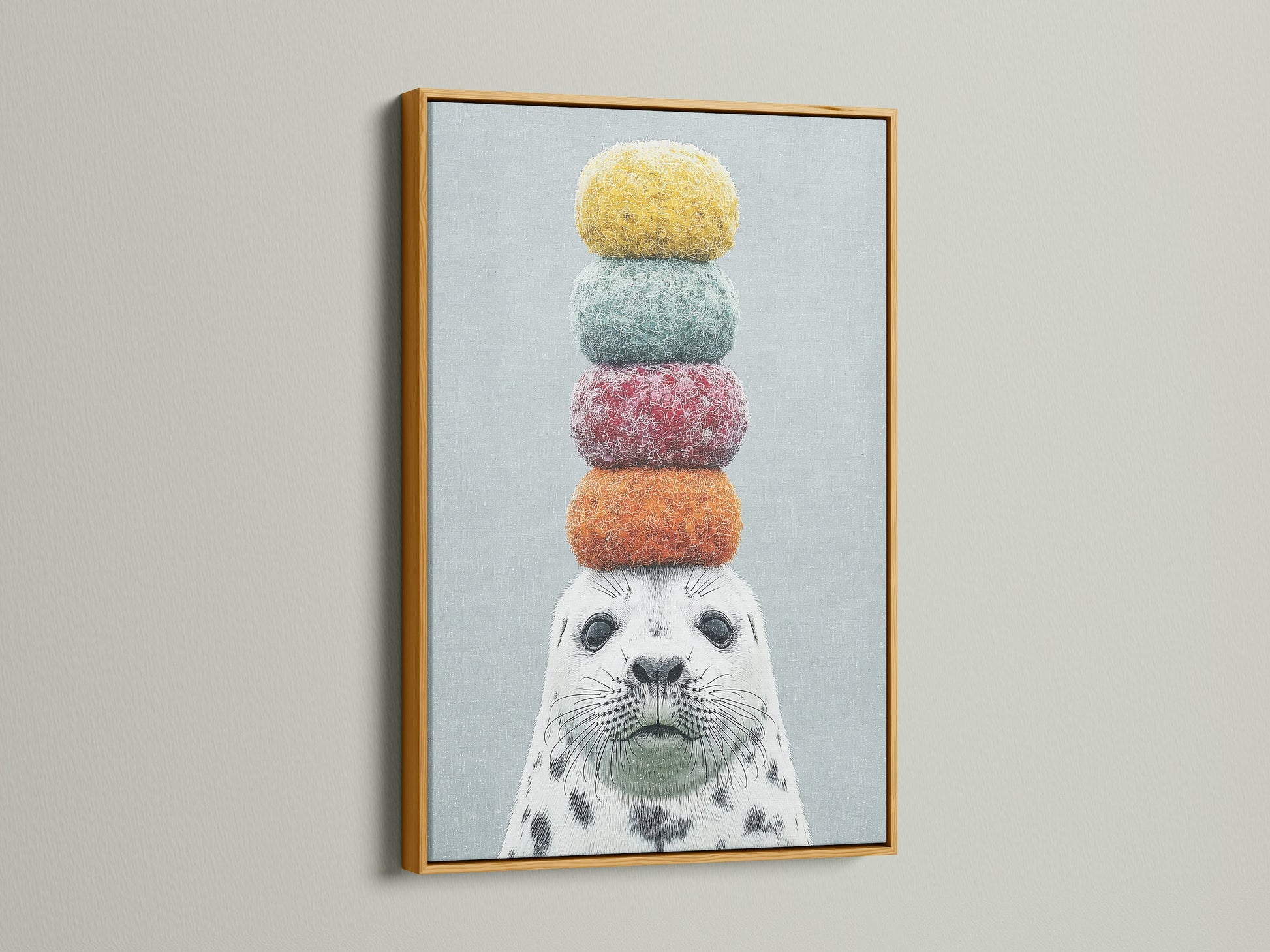 The charming seal artwork with macarons is highlighted by a gold frame. A touch of elegance to this playful animal art. Perfect for adding a whimsical touch to any room. This colorful canvas print is a delightful choice for nursery or kids room decor.