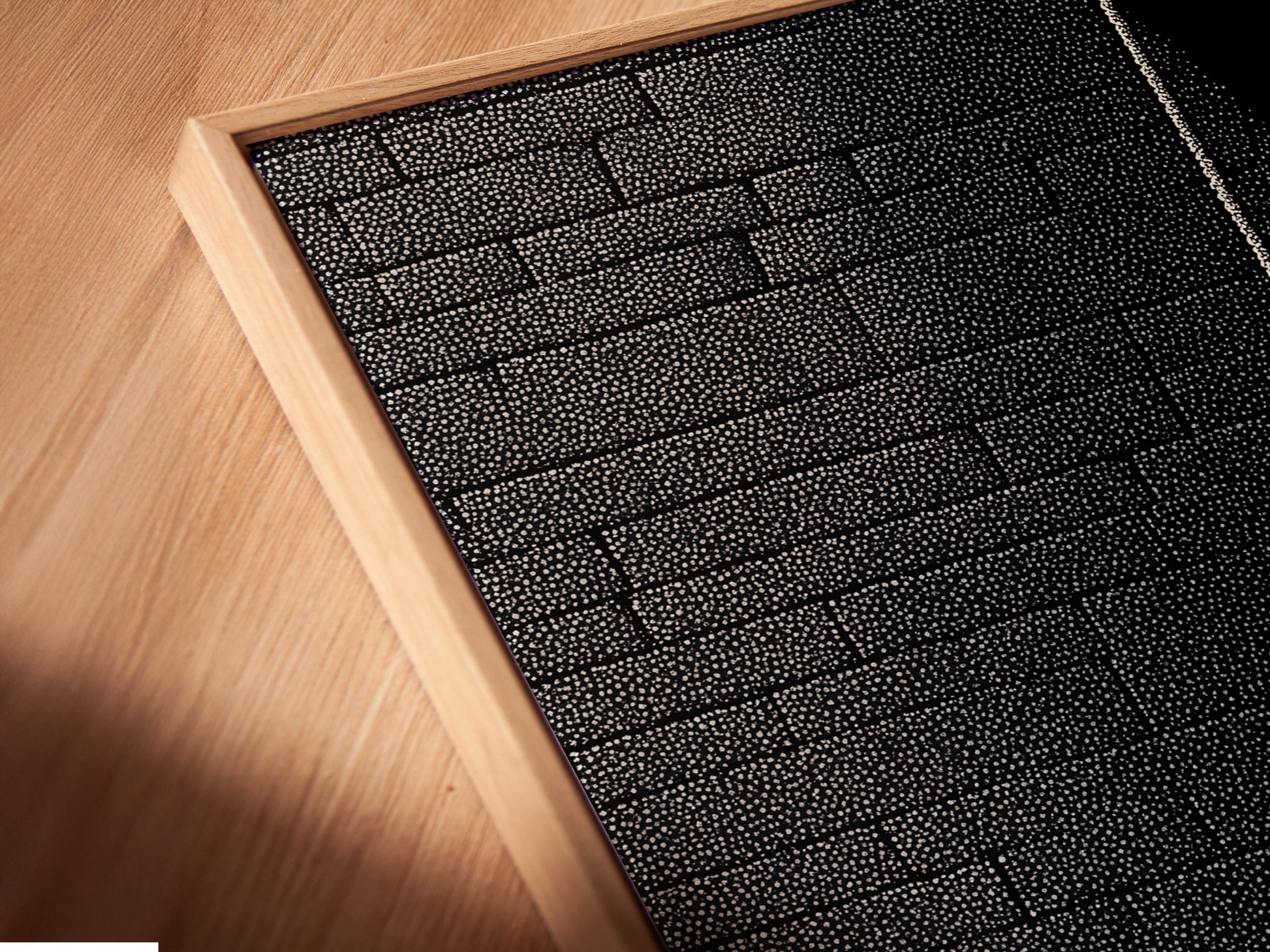 A close-up angled view reveals a canvas print. It is beautifully presented in a floating frame. The frame enhances the art giving it a gallery-like appearance. Experience the beauty of canvas art. Explore our artwork today.