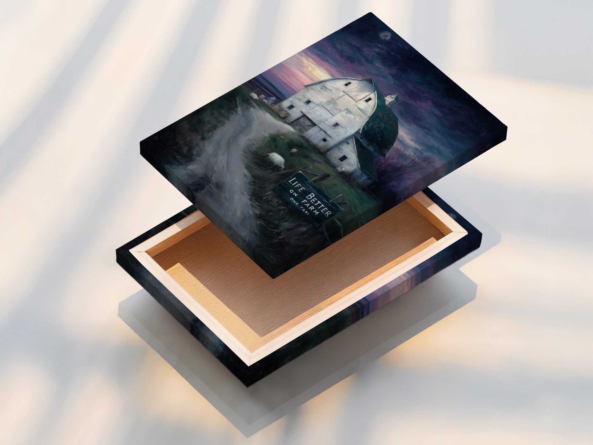 A close up shot of a stretched canvas print. The farmhouse canvas print is stretched and ready to hang. This rustic barn wall art adds charm to any room. Country landscape artwork brings the outdoors in. A perfect piece of kitchen art for your country home.