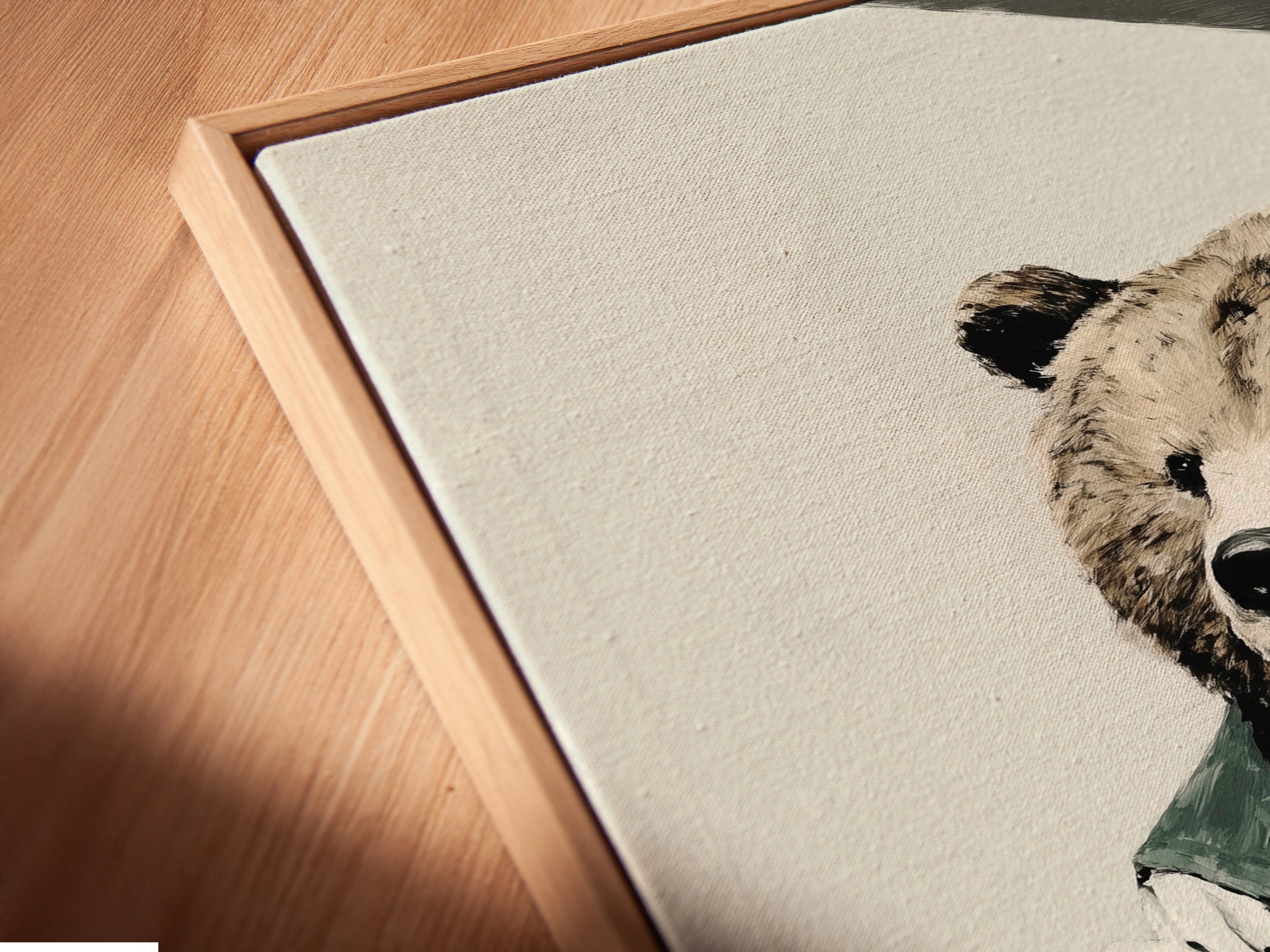 A close-up angled view of the canvas print in a floating frame. The floating frame gives the artwork a gallery-like appearance. Perfect for showcasing the bear baker artwork. The canvas print enhances the texture and details. Shop now