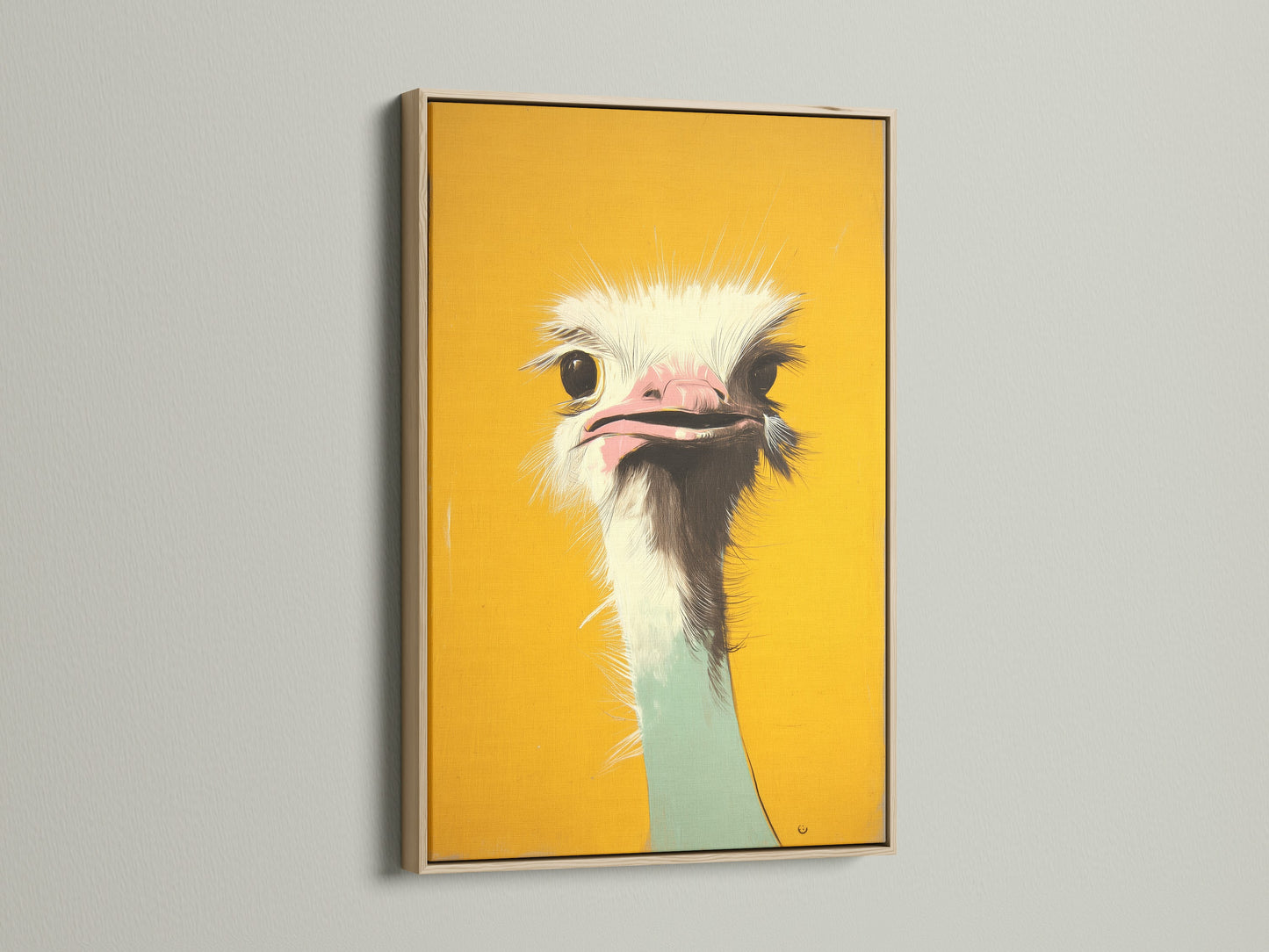 A close up view of a striking ostrich art print in an oak frame. The frame enhances the artwork's natural tones. This piece adds warmth and character to your living space. Find framed art today.