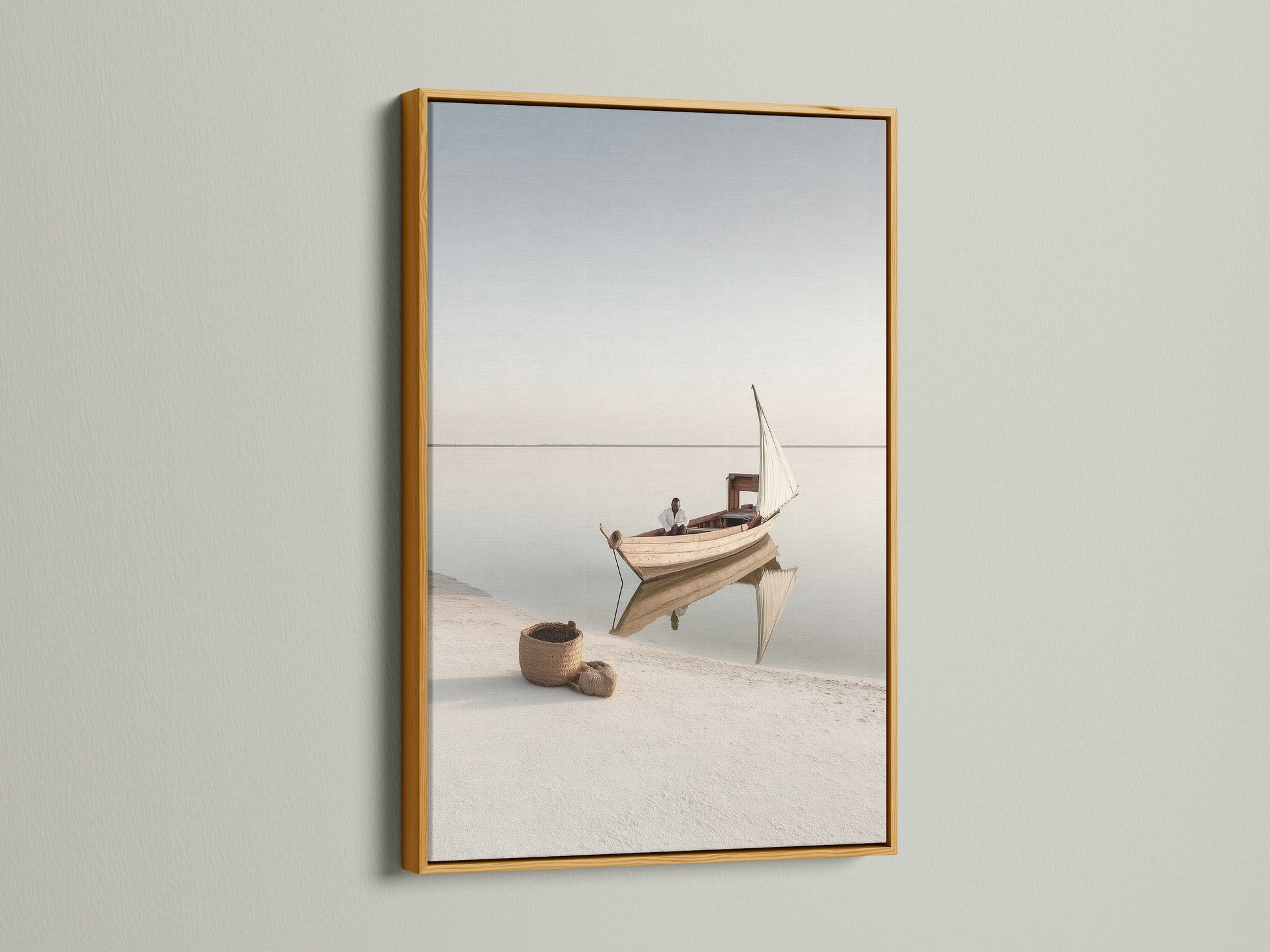 Coastal Artwork in a gold frame. This elegant sailing boat photography adds a touch of luxury to your space. The gold frame enhances the serene ocean view. Perfect for creating a sophisticated coastal theme.