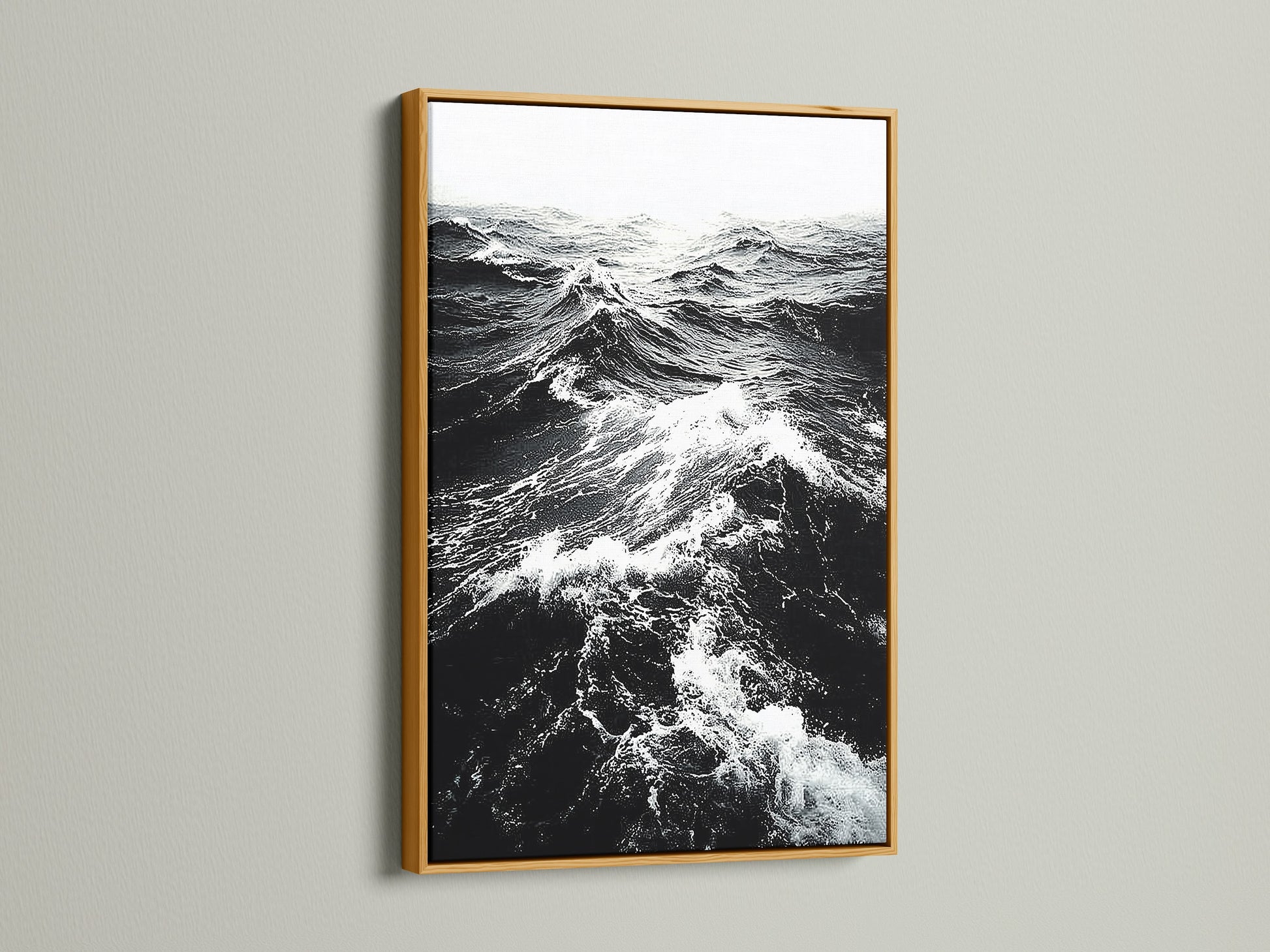 A gold frame displays black and white ocean wave artwork. The metallic finish adds a touch of elegance. Ideal for sophisticated coastal wall art. Perfect for a beach house decor. Browse our wave artwork now.
