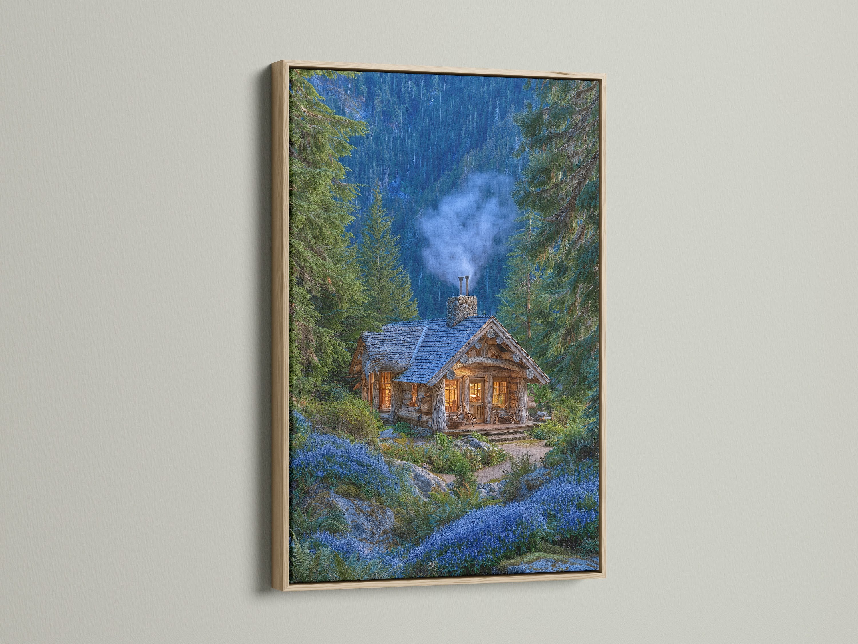 A framed forest cabin artwork with an oak frame is displayed. The artwork features a cozy mountain lodge nestled among pine trees and blue flowers. This rustic woodland cottage art brings nature indoors. The oak frame enhances the artwork's natural and warm tones.
