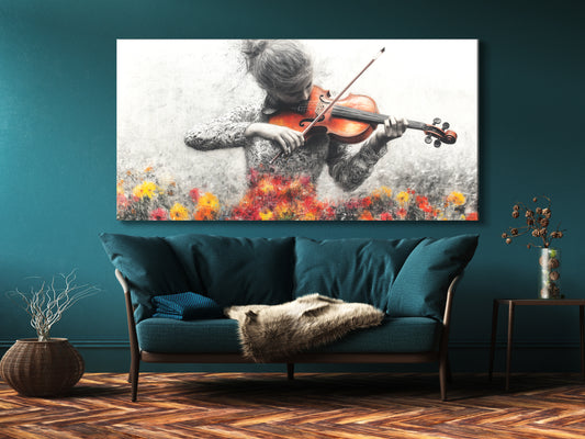 Wall Art of a grayscale violinist with vibrant floral accents, displayed above a blue sofa in a modern living room.