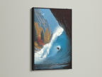 Black frame accentuating the surfing wave canvas print. The dark frame makes the ocean artwork pop. This wave print is a striking piece of coastal wall art. Ideal for a modern beach house. A surfer gift that stands out. The black frame adds a contemporary touch.