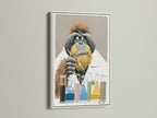 This is a white frame featuring the Orangutan Scientist art. The artwork features a thoughtful orangutan in a lab coat. Test tubes filled with colorful liquids sit before him. This unique piece is perfect for adding a touch of curiosity to your home or office decor.