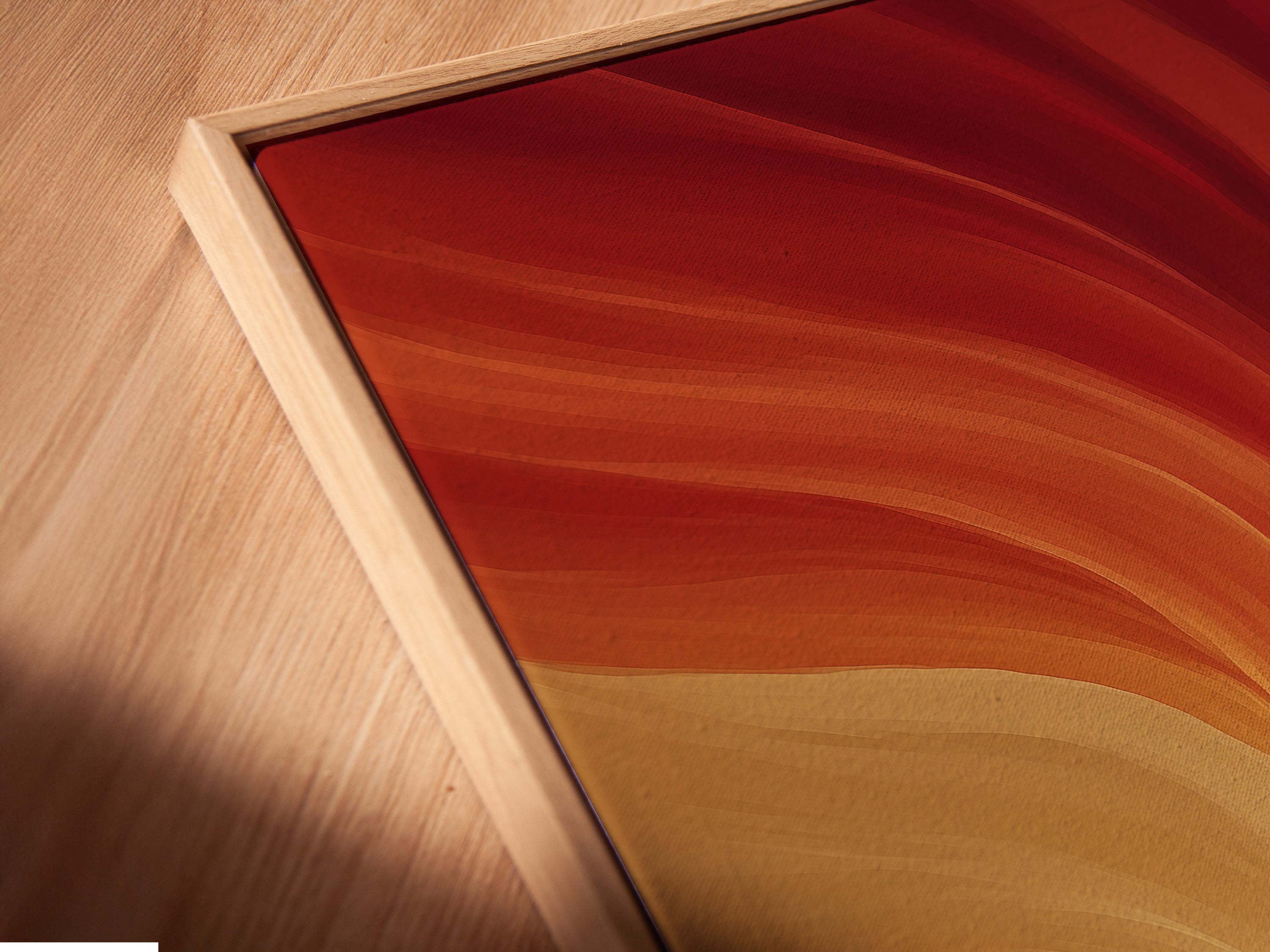 This is a close-up of the Abstract Runner Canvas Art in a floating frame. The floating frame gives a sleek modern look. The warm orange swirl artwork appears to float. It adds depth to the contemporary motion print. Ideal for abstract wall decor.