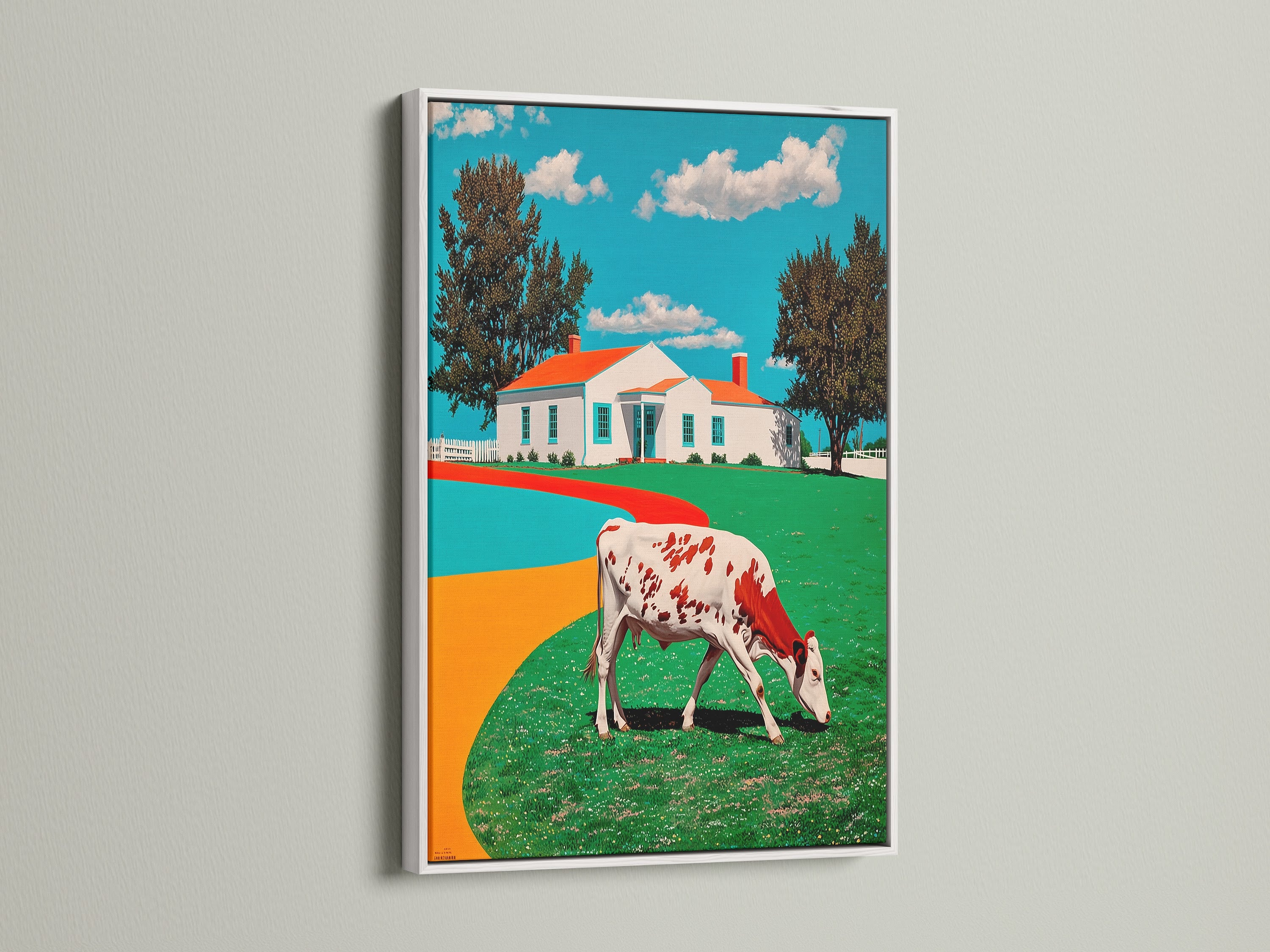 Cow Canvas Print in a White Frame. This art shows a red and white cow grazing in a green pasture. The crisp white frame adds a clean look to the farmhouse wall art. This piece is perfect for kitchen art or living room decor. The countryside print brings a touch of rustic charm. Ideal for cottagecore-themed homes. Find this animal artwork to brighten your space.