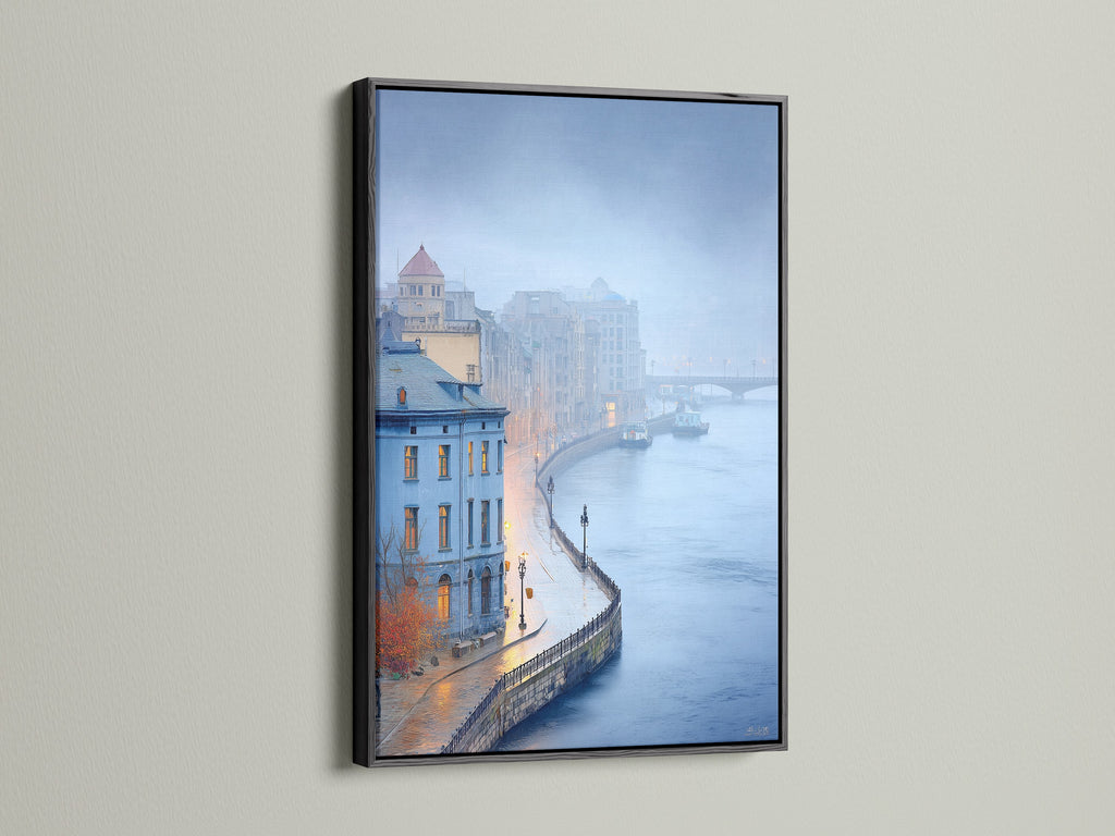 Moody blue cityscape art print in a black frame. The artwork captures a European city scene. A black frame provides a modern contrast. Perfect for adding a stylish touch to your office or living room wall decor.