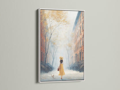 Cityscape canvas in a white frame. Features a girl and dog in an urban setting. This autumn wall art brings a neutral and peaceful vibe. Enhance your living room wall with this scenic artwork.