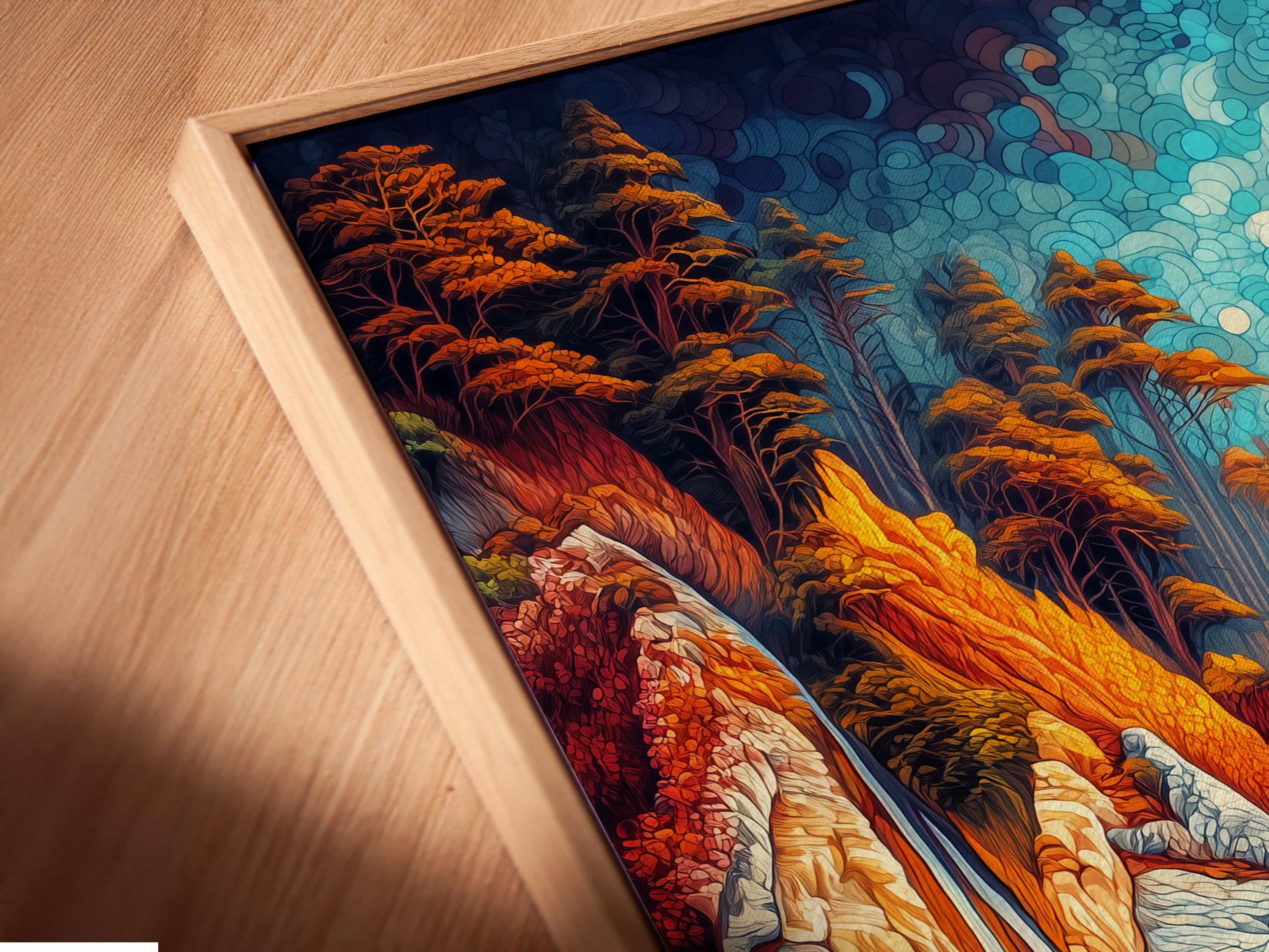 A close-up angled view of a coastal landscape canvas print in a floating frame. The frame enhances the artwork's vibrant colors. It features a turquoise ocean rocky cliffs and lush trees. This seascape artwork is perfect for coastal and modern homes.