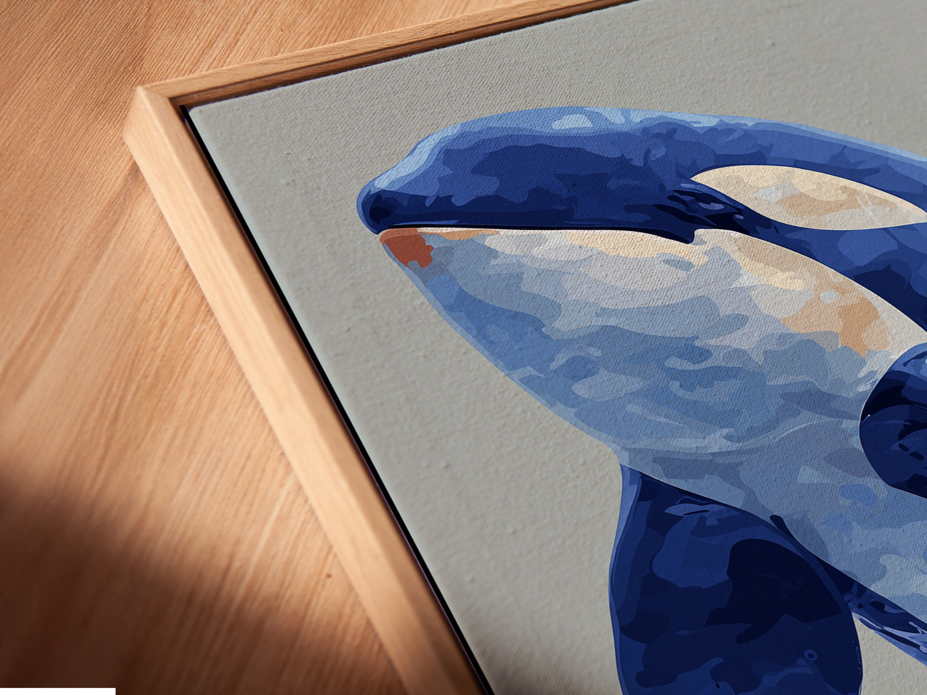 Experience the beauty of our Orca Whale canvas print up close. This angled close-up showcases the artwork in a floating frame. The floating frame adds a touch of sophistication to any room. Discover the intricate details of this marine animal artwork. Perfect for coastal wall decor. Transform your space with this stunning ocean canvas art.