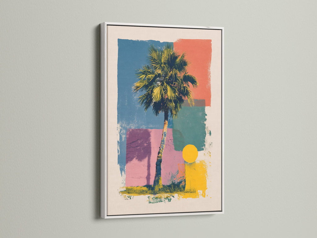 Artwork in a white frame hanging on a wall. The artwork showcases a palm tree and geometric shapes in vibrant colors. The white frame provides a clean modern look. Enhance your interior with this framed piece of art.