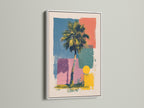 Artwork in a white frame hanging on a wall. The artwork showcases a palm tree and geometric shapes in vibrant colors. The white frame provides a clean modern look. Enhance your interior with this framed piece of art.