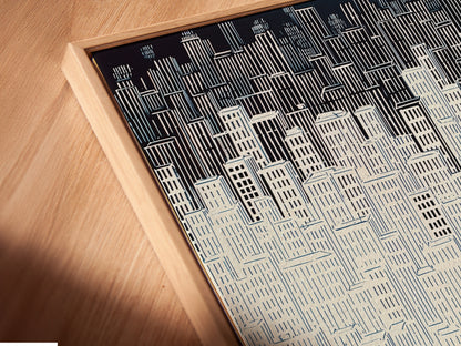 A close-up angled view reveals a canvas print in a floating frame. The floating frame enhances the artwork's presence. Perfect for modern wall decor. This cityscape artwork is a stunning addition. The minimalist building print complements urban art.