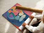 A woman is carefully rolling a fine art poster paper. The focus is on preserving the quality of the artwork. The poster paper ensures a smooth finish. It is ready for framing or display. Great quality is assured.