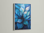 A blue flower artwork is displayed within a white frame. The white frame enhances the art's vibrant colors. This botanical canvas print brings a fresh modern look to any room. It is a great choice for homeowners seeking contemporary art. It suits minimalist coastal styles and is perfect for bedroom wall decor.