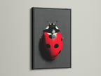 The ladybug art is presented in a black frame. The dark frame accentuates the vibrant red beetle. This insect wall art is a great addition to kids rooms or modern homes. The black frame provides a sophisticated touch.
