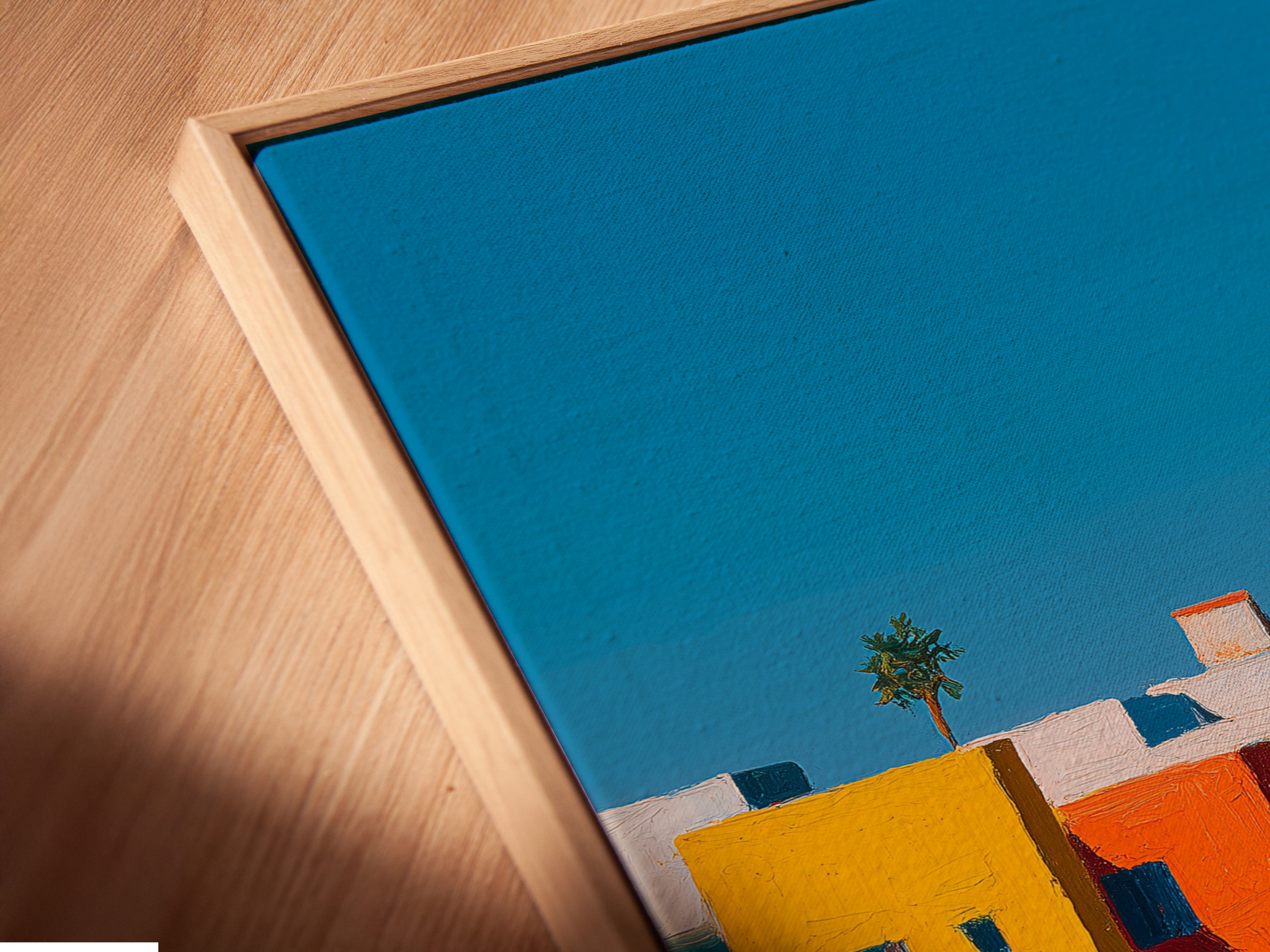 Here is a close-up of a canvas print in a floating frame. The floating frame gives the art a modern look. The canvas print presents a colorful scene. It appears to hover against the wall adding depth and dimension.