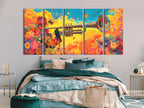 Floral trumpet canvas art with vibrant colors above a bed in a modern bedroom